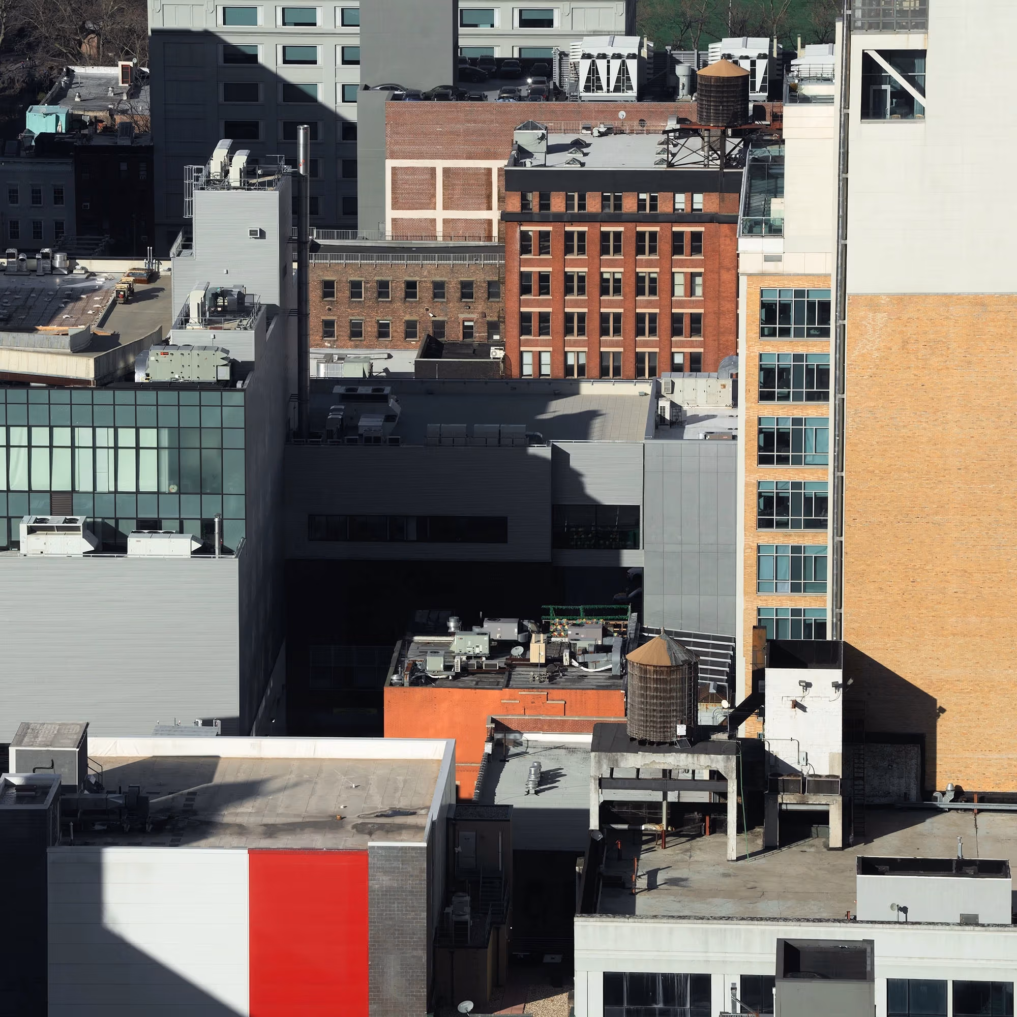 A cityscape view of a mix of modern and historic buildings with rich and colorful tones.