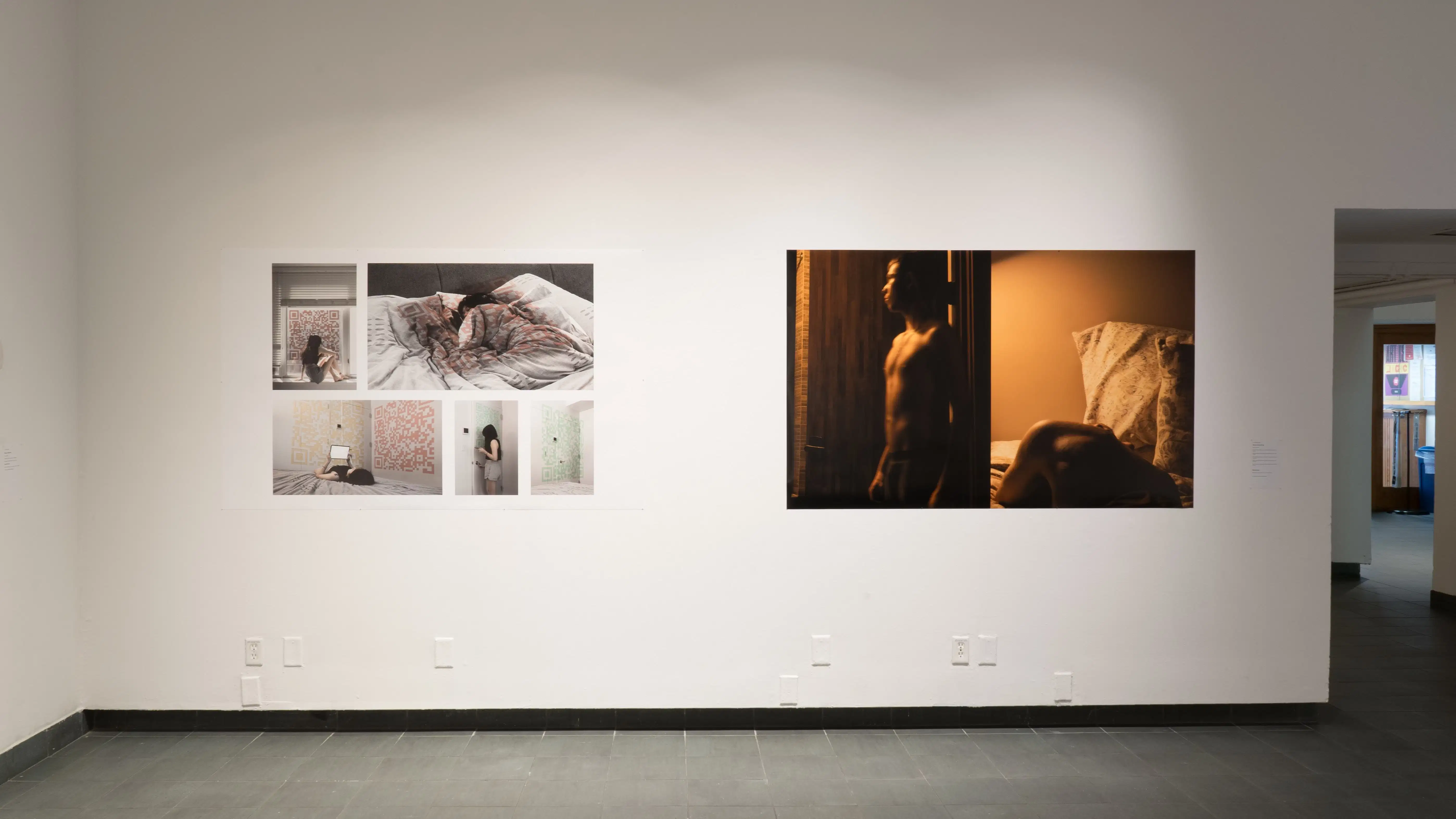 A closer view of one wall in the back gallery, showing two large prints: the left has five images of a figure in different poses in a light filled interior, the left has two adjacent images of a figure in different poses in a dimly-lit interior.