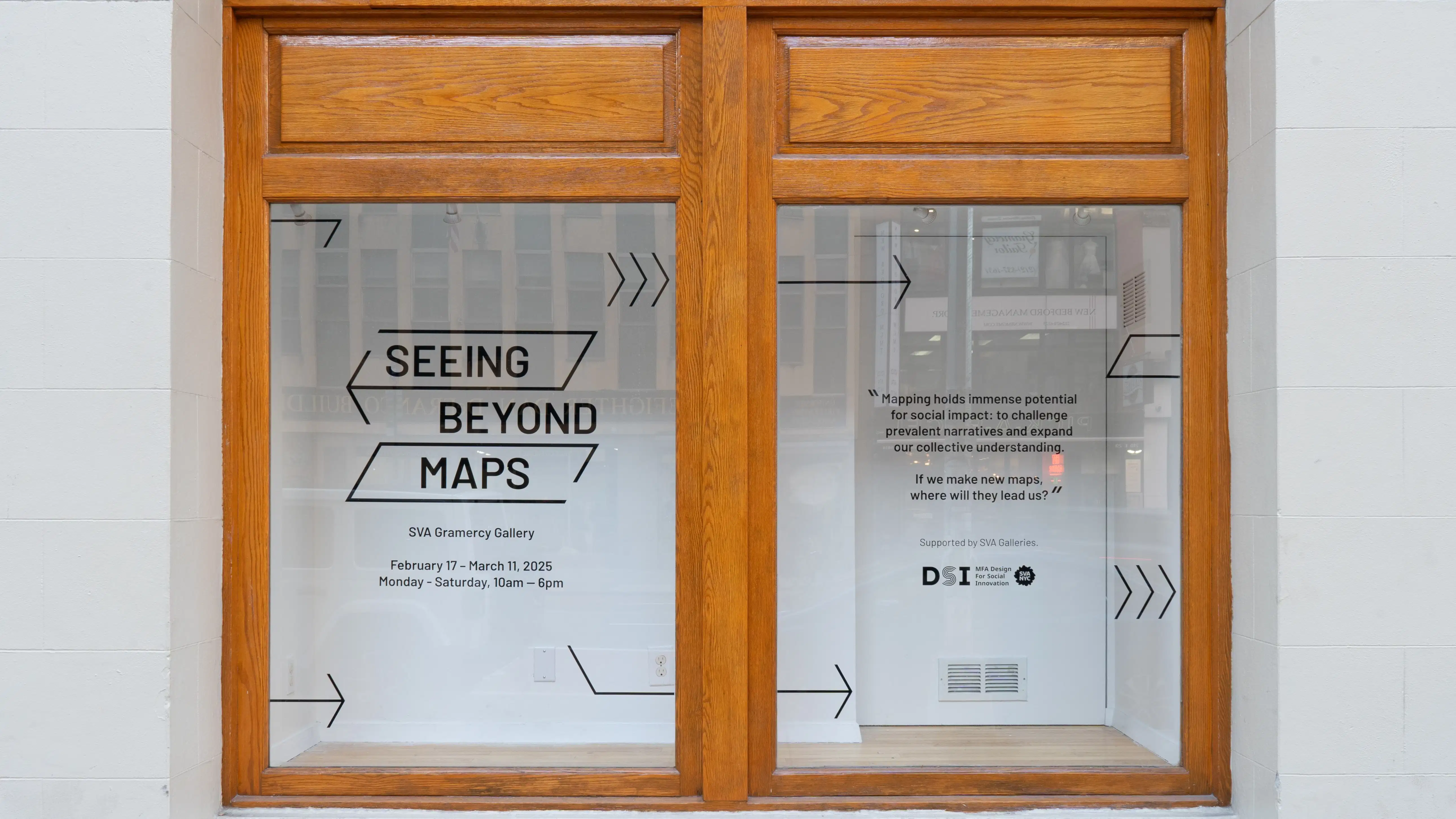 Outside the gallery, vinyl is applied to the display wall and window to advertise the exhibition. It reads “Seeing Beyond Maps / SVA Gramercy Gallery.”