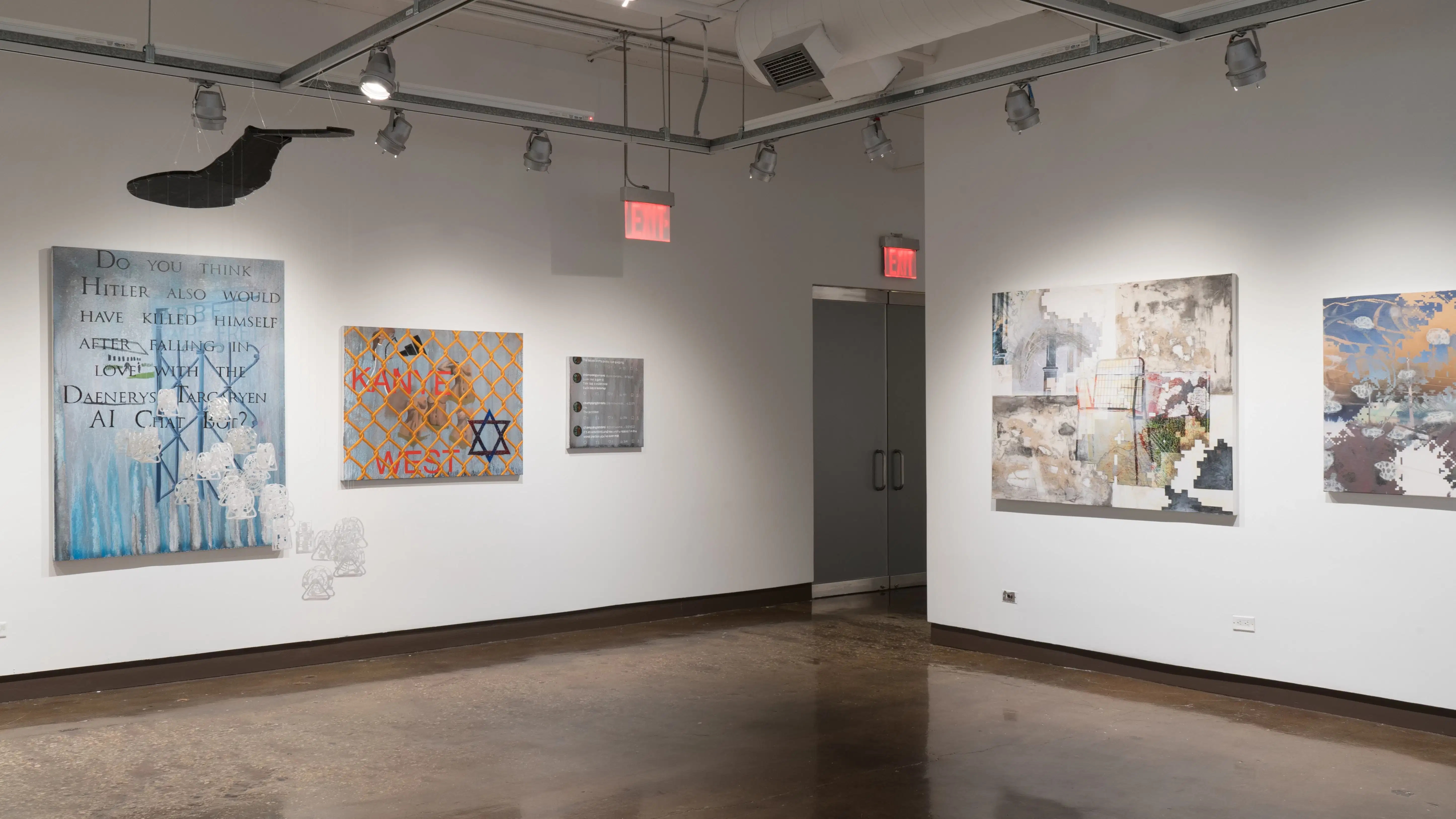 In a corner of gallery one, a group of small plastic sculptures are suspended from the ceiling. Behind them, three paintings of varying sizes hang on the wall across from large mixed media works on canvas.