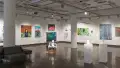 A wide view of gallery one shows a range of paintings, sculptures, and mixed media works.