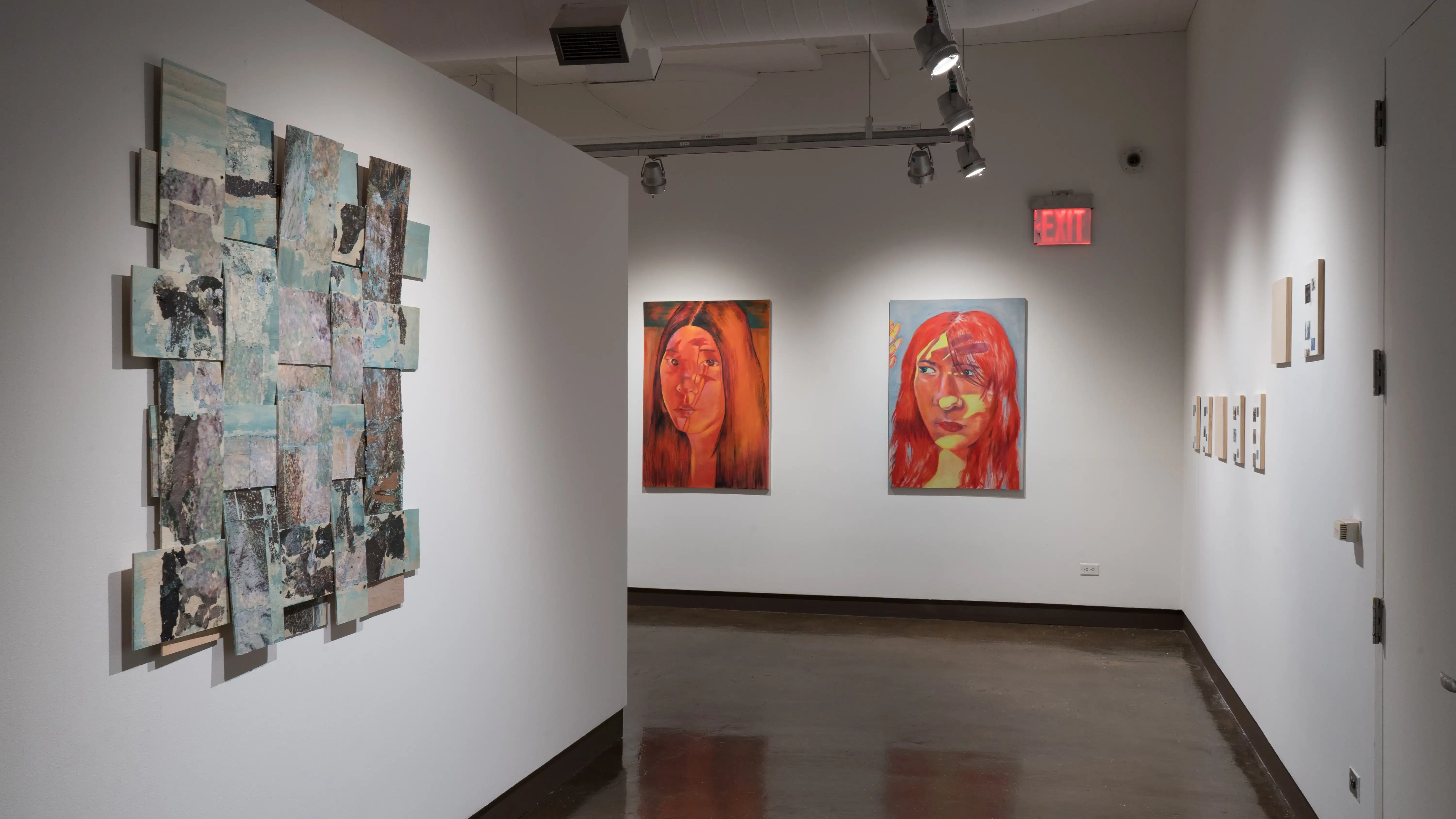 A painting on a substrate made of large sheets of thin wood woven together hangs in the right hallway leading into gallery four. In gallery four, small square wood panels hang across from large portraits of women.