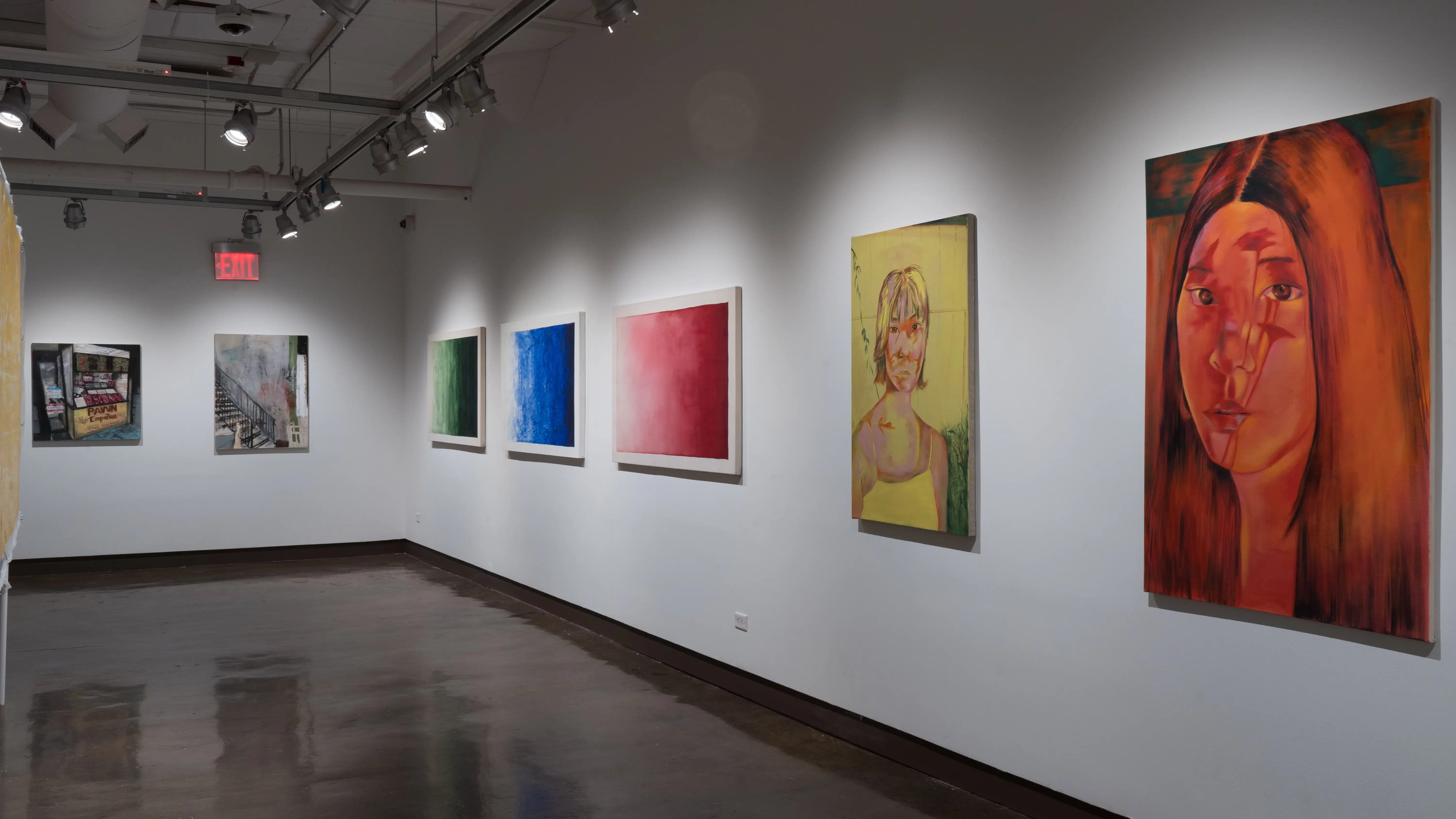 Many large paintings hang on the walls of gallery four. Some are greyish scenes of city life, while others are large swatches of color. Closer, there are portraits of women done in bright, unnatural colors.