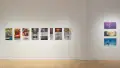 A straight shot of the SVA Flatiron Gallery's west wall, showing many colorful prints by BFA Animation students pinned up.