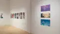 An angled shot of the SVA Flatiron Gallery's west wall, showing many colorful prints by BFA Animation students pinned up.