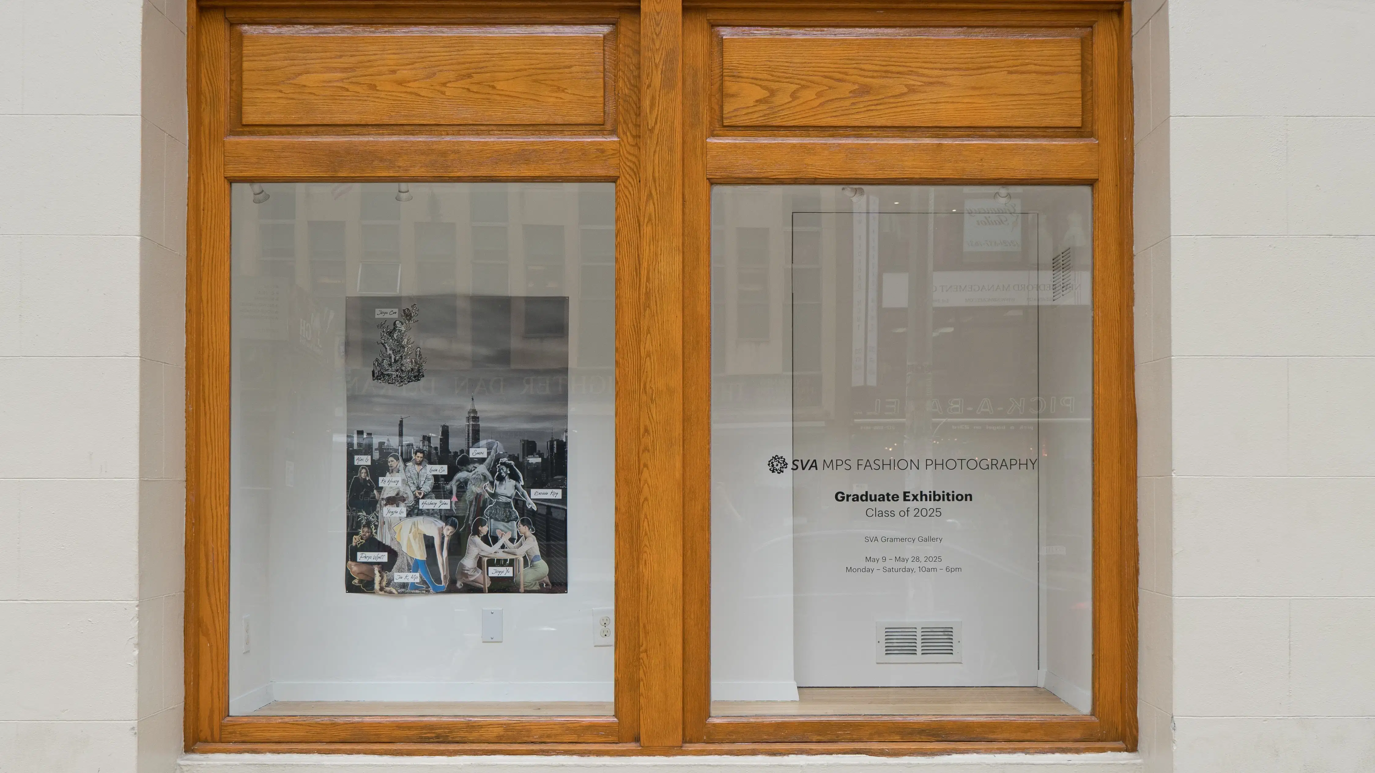 In the window display of the Sva Gramercy Gallery, a poster advertising the SVA MPS Fashion Photography Graduate Exhibition hangs. The poster is behind glass, and depicts an array of models posing before a black and white New York skyline.
