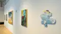 From the opposite end of the SVA Flatiron Windows hallway, the large paintings are visible along with a painting on an organic-shaped panel.