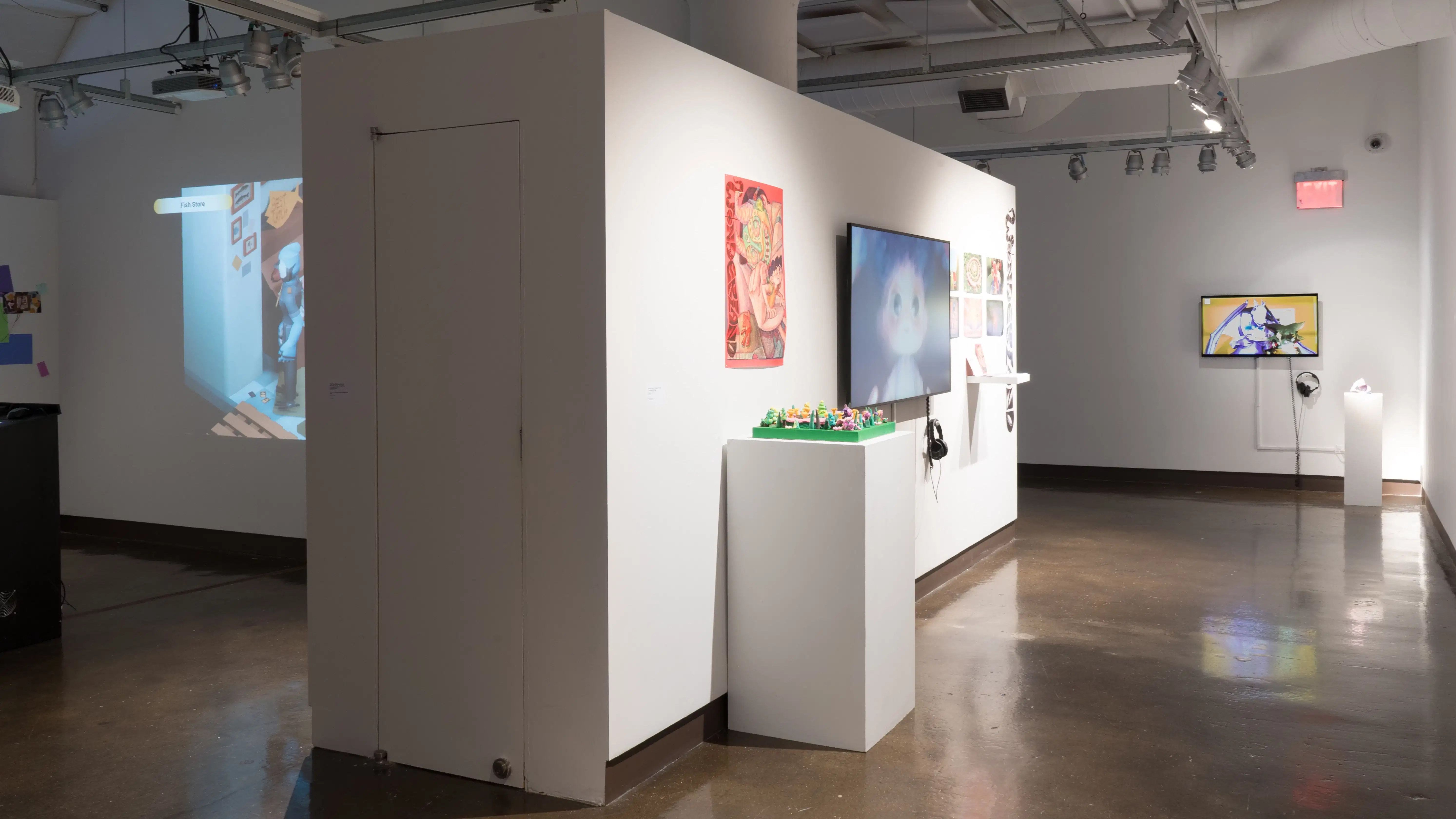 The gallery three alcove is visible on the far left, looking toward the back wall of gallery four. In the hallway, a large TV monitor plays an animated video, while prints are hung on either side. A pedestal holds a colorful sculpture.