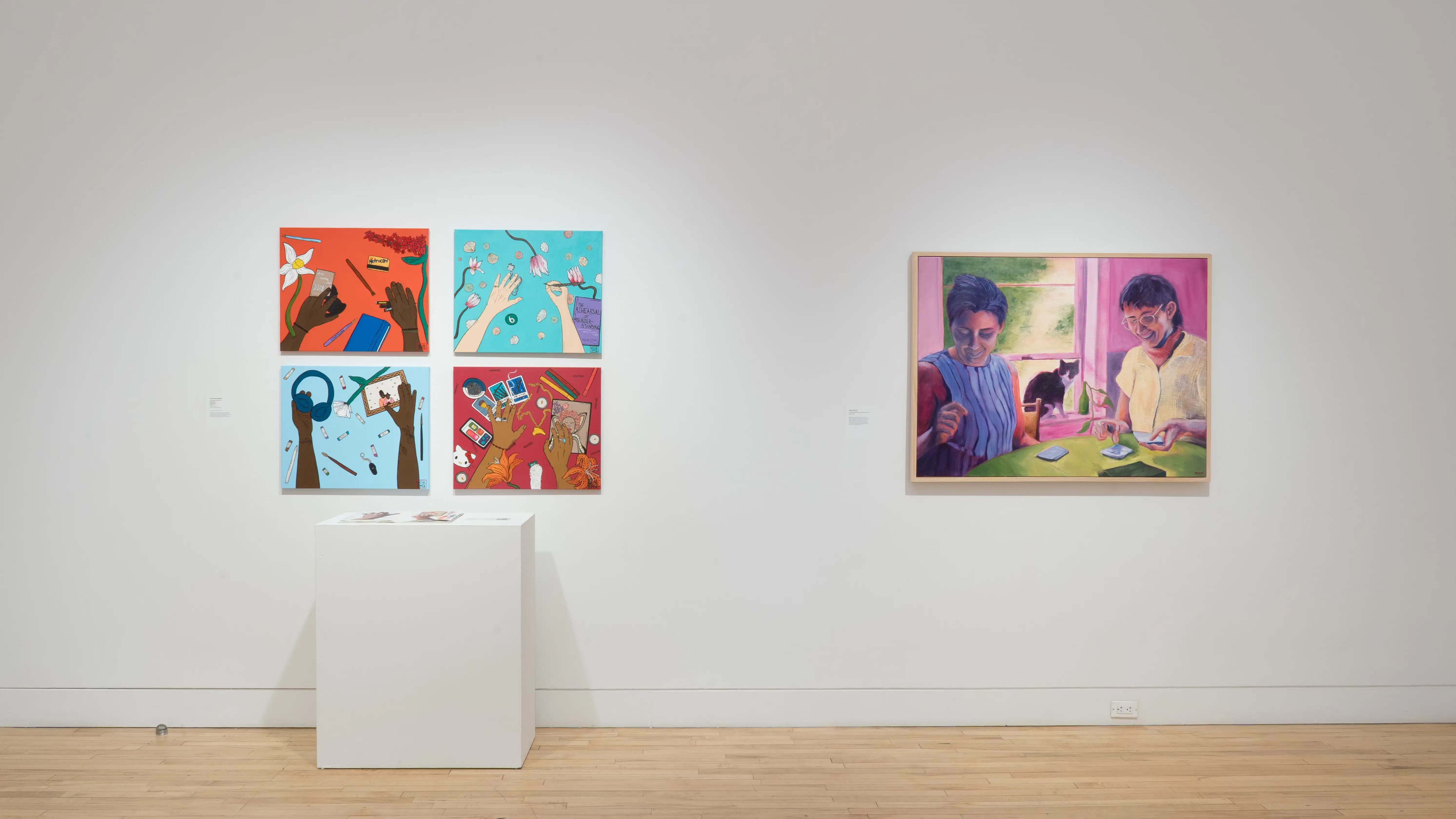  Straight shot of the north wall at the SVA Flatiron Gallery, showing a grid of bright paintings on the left and a large portrait of two figures on the right.