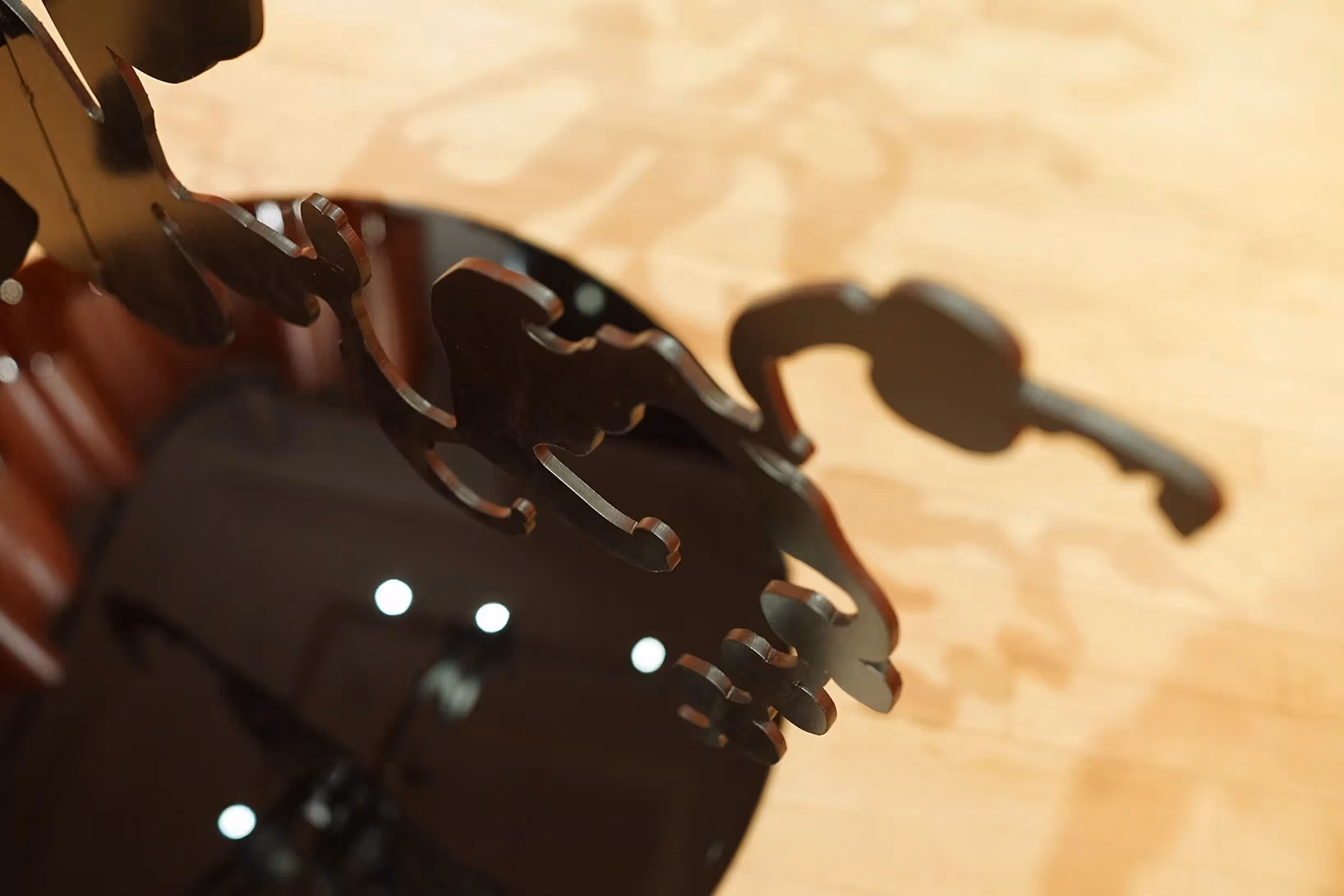 detail shot of the black plexi sculpture over the black circle on the floor