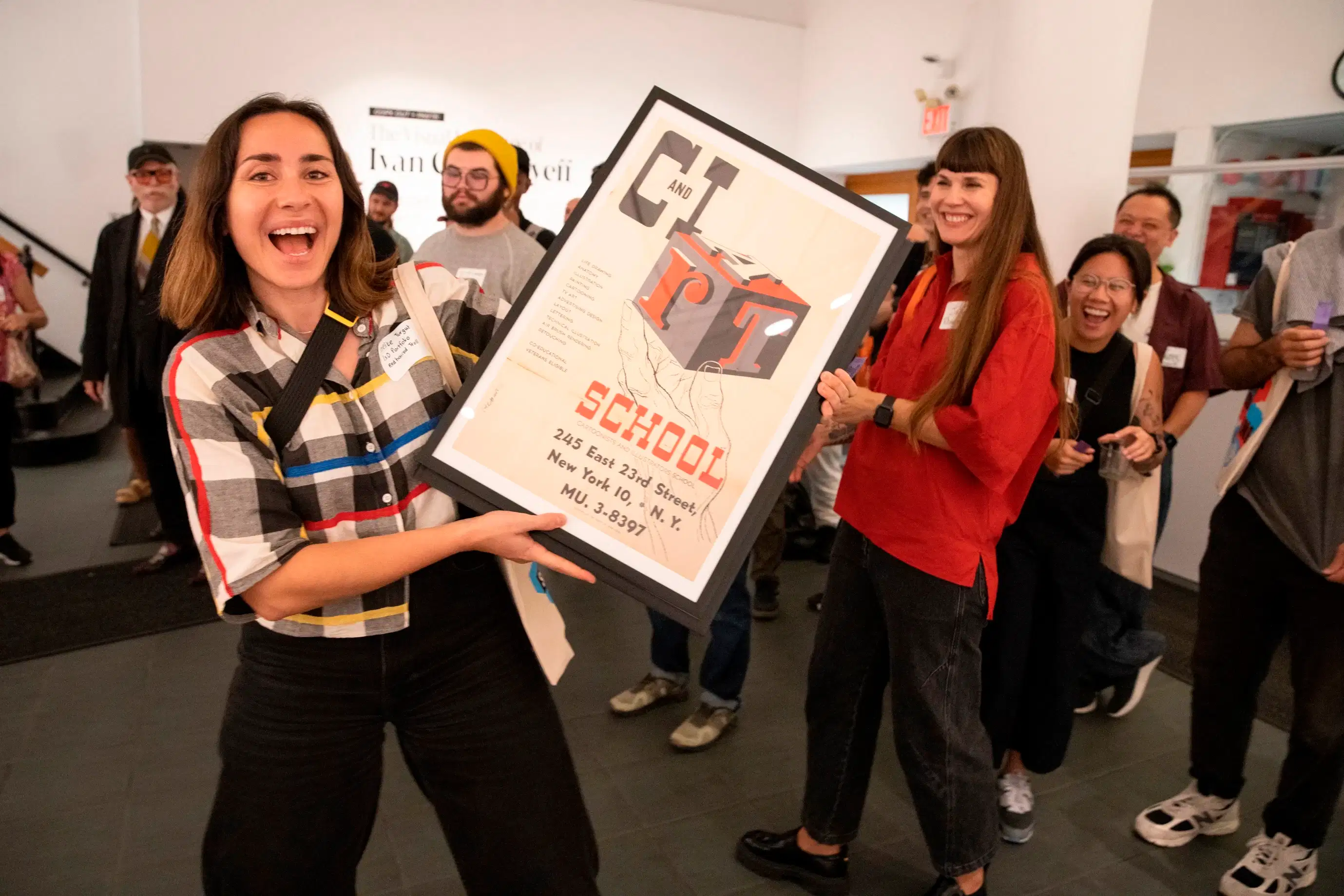 Even the faculty gets a chance to have some fun! An instructor wins a raffled poster at our annual Faculty Appreciation Mixer.