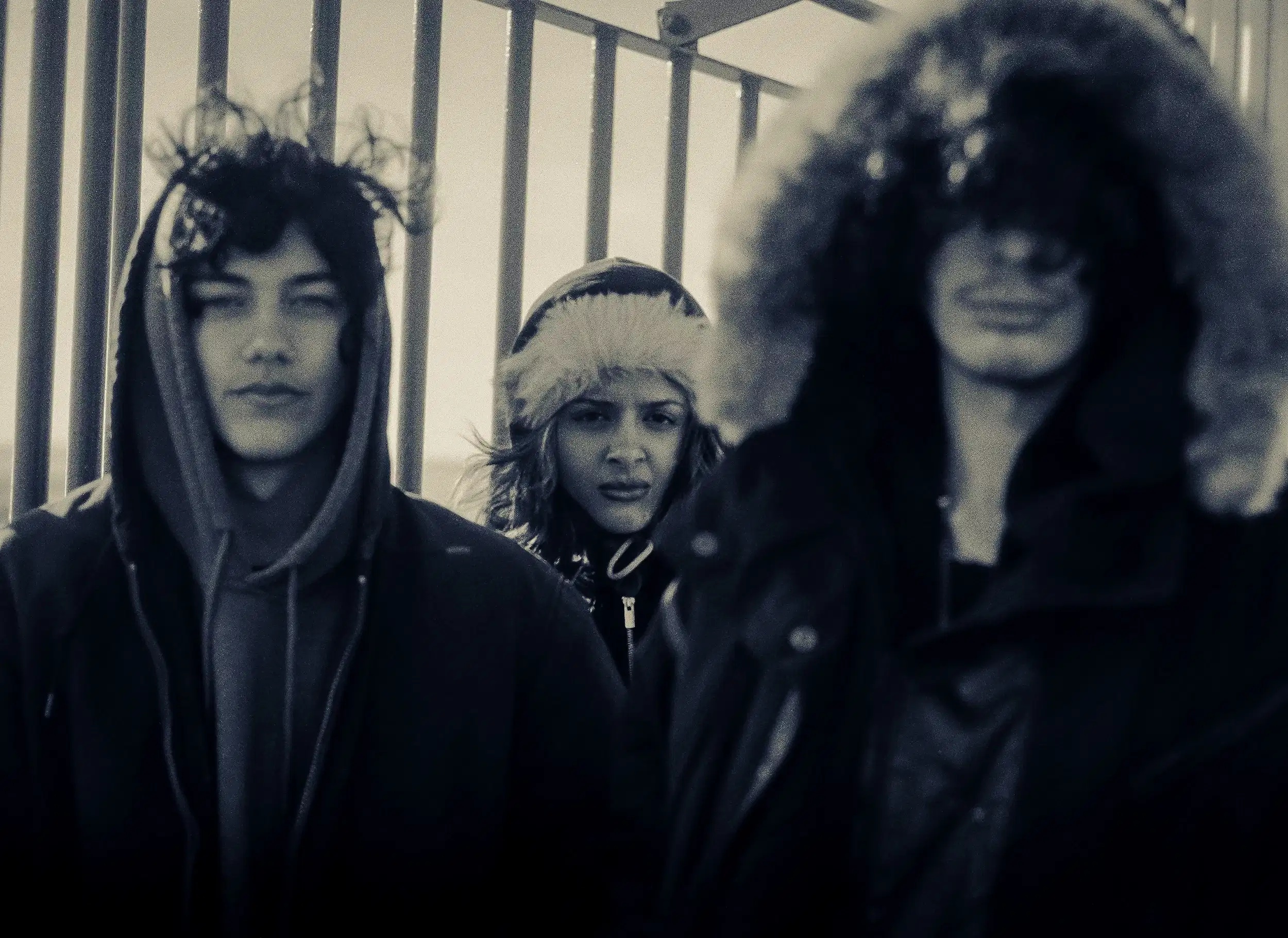 3 people in the top of a lighthouse 