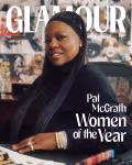 A cover of the magazine GLAMOUR, with an African American woman sitting at a creative’s desk with a wall of fashion collage behind her. She is smiling at the camera, and listed as “Pat McGrath: Women of the Year”.