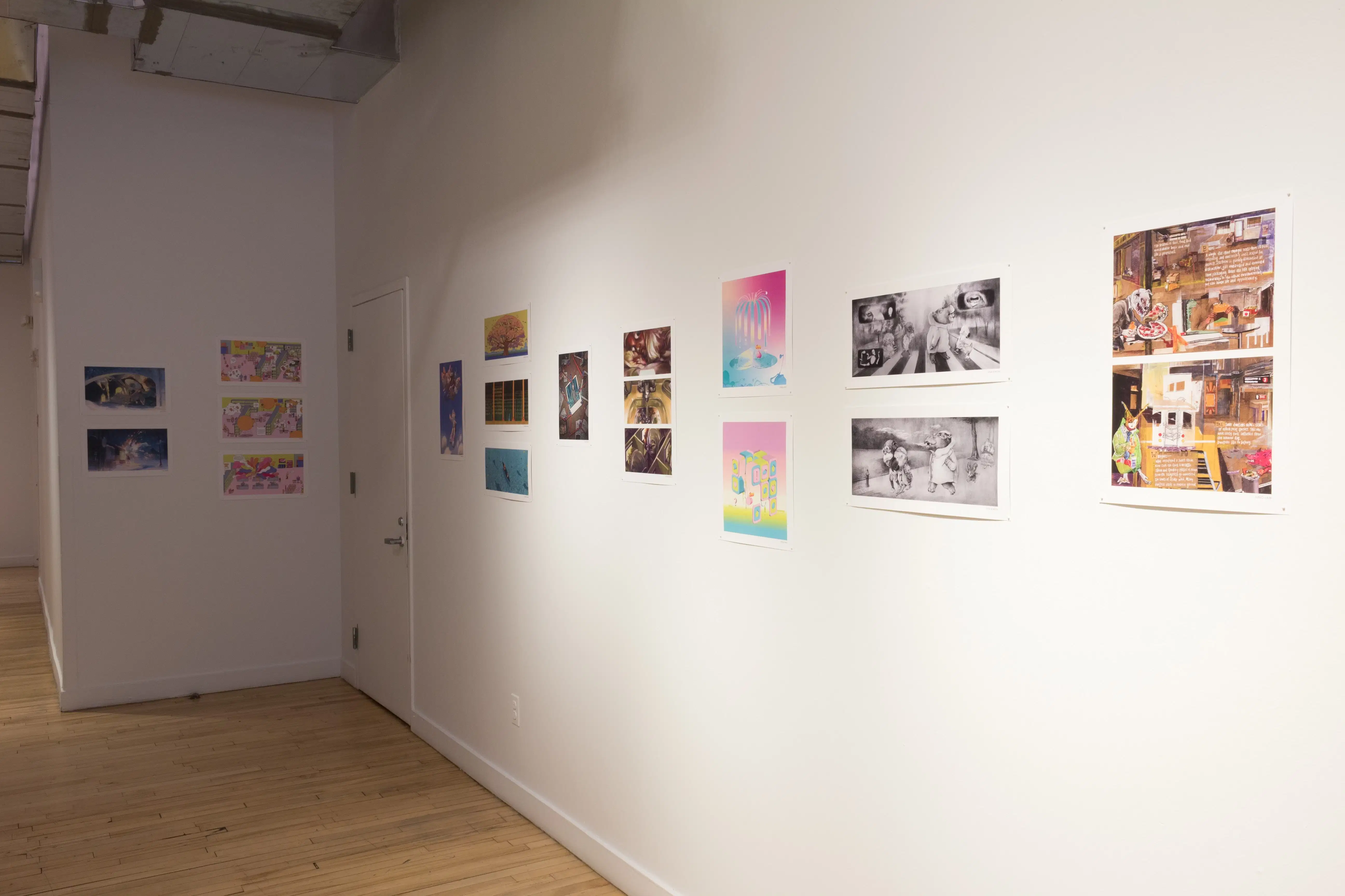 A series of illustrative prints are arranged along the wall, some in black and white and some in color.