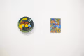 Installation shot of two small paintings.