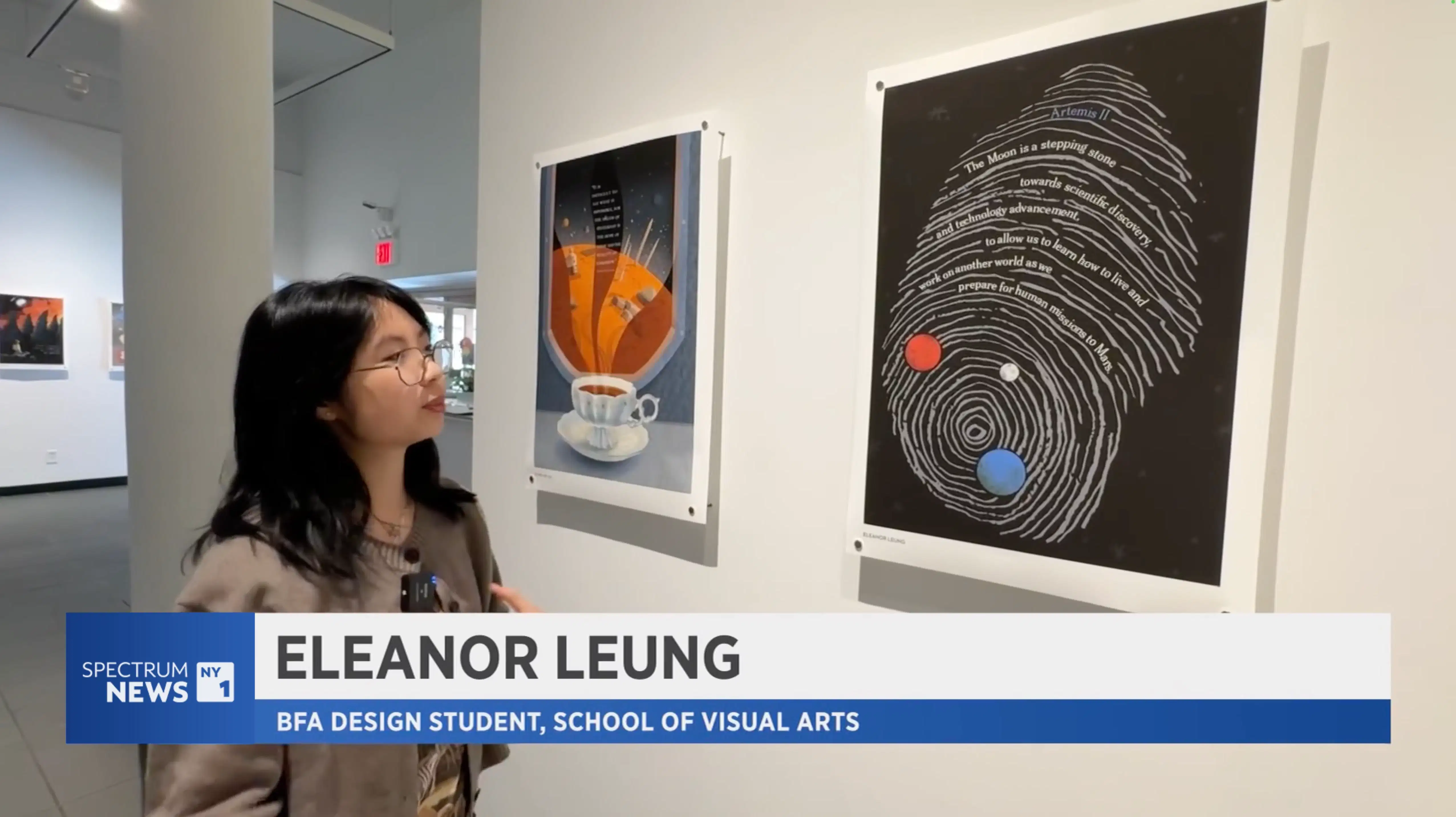 A young woman with glasses and black hair stands in an art gallery, looking at two posters on the wall. The one she looks at shows a large fingerprint design with planets incorporated into the lines and text related to Artemis II, and the poster next to it shows a teacup with vibrant, abstract shapes rising from it. A lower-third graphic from Spectrum News NY1 identifies her as “Eleanor Leung, BFA Design Student, School of Visual Arts.”