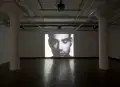 An art gallery showcasing a photograph of a man.