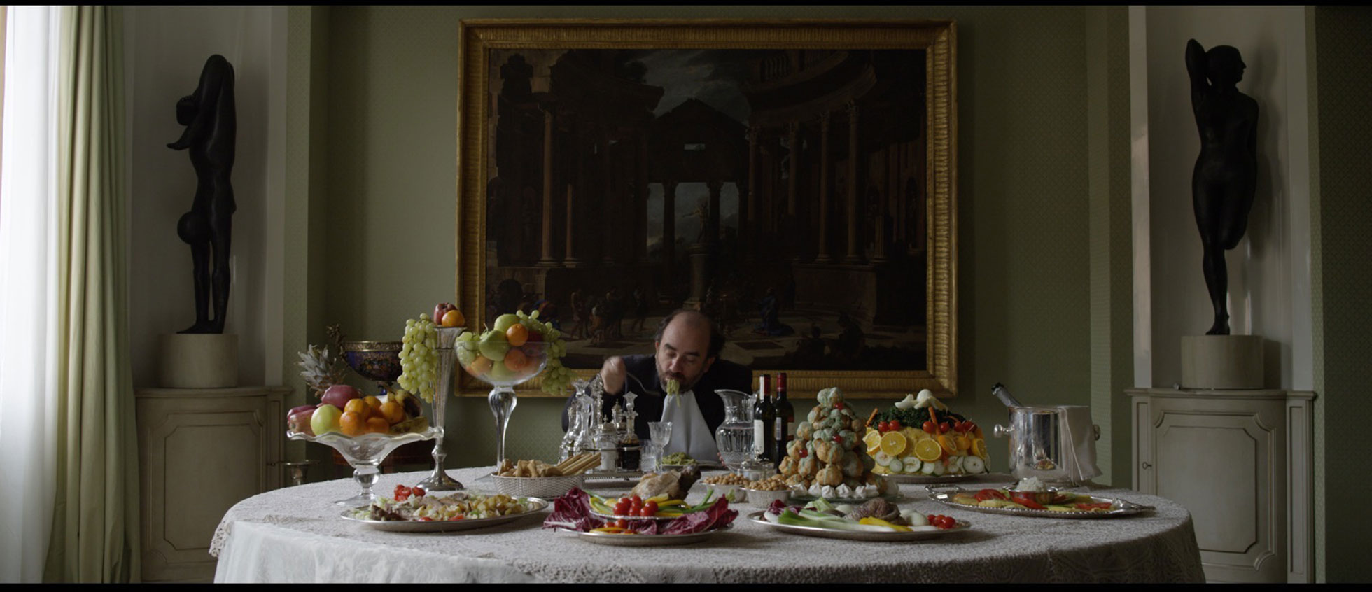 a wealthy man having an extravagant dinner