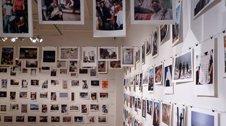 polaroids hanging from ceiling and wall