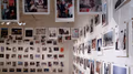 polaroids hanging from ceiling and wall