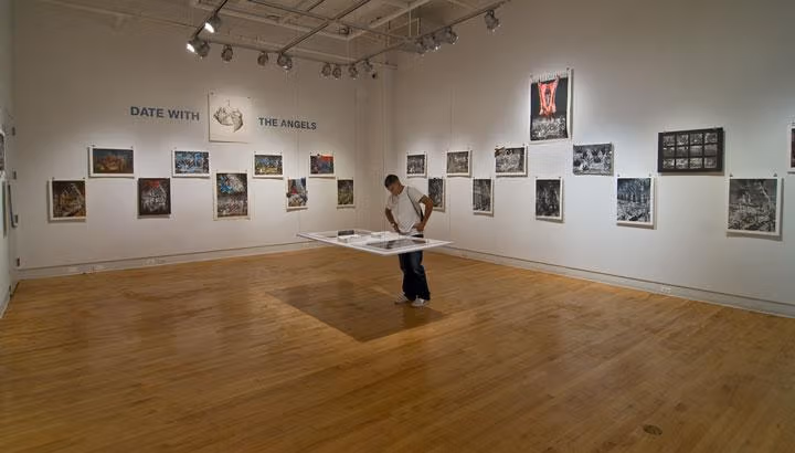 A man viewing an exhibit in a modern art museum.