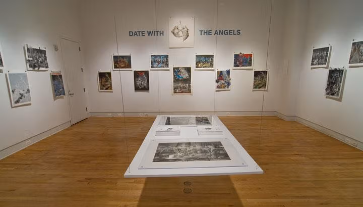 An art gallery will with art, and in the middle a small gallery suspended in air.