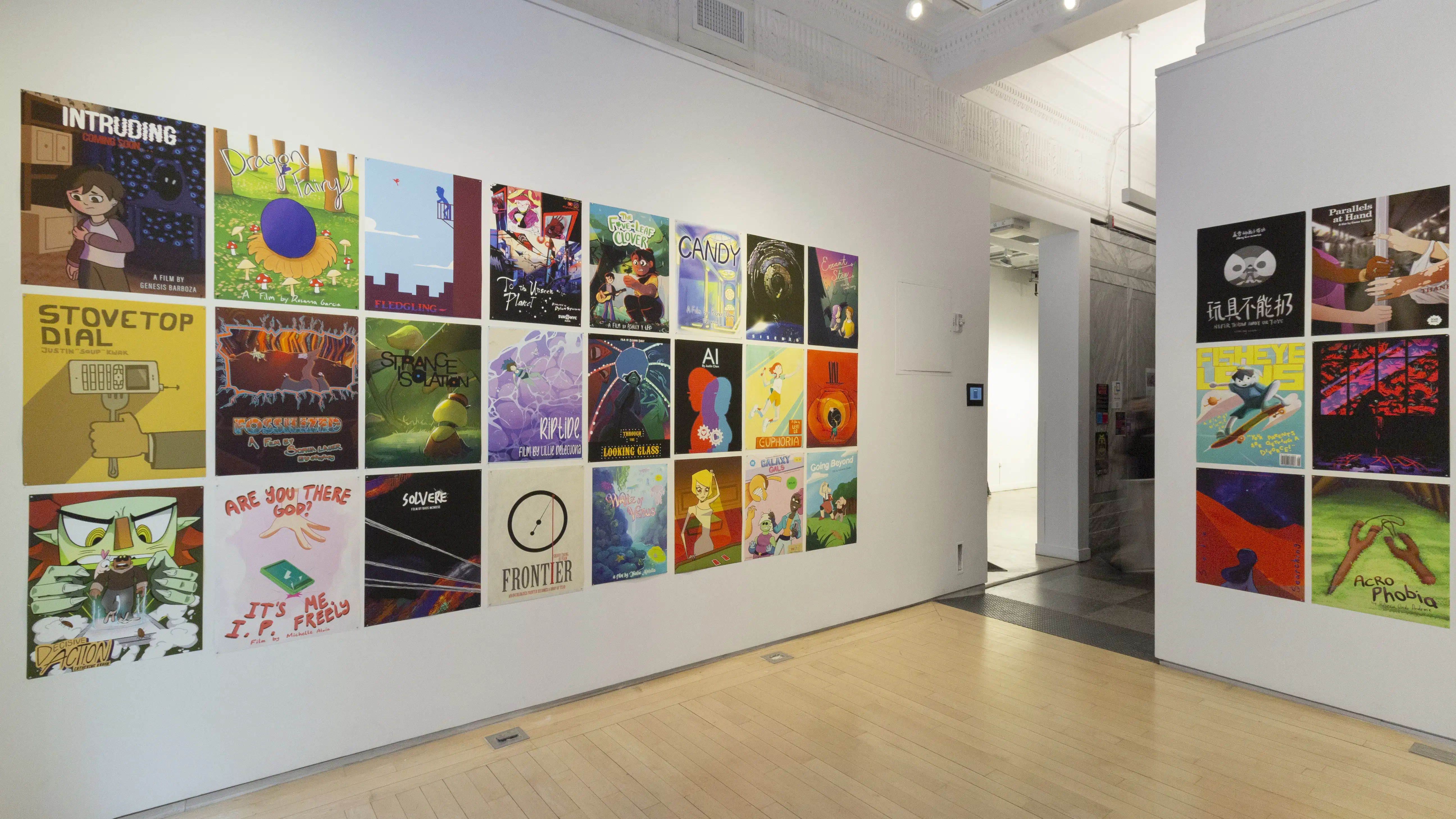 Multiple views of SVA Flatiron Windows and Flatiron Project Space. There are monitors hung in the Windows with films playing and film posters hung in the Flatiron Project Space.