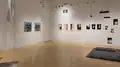 Multiple views of SVA Flatiron Gallery and Windows with installation, photographs, and textile throughout the gallery. 