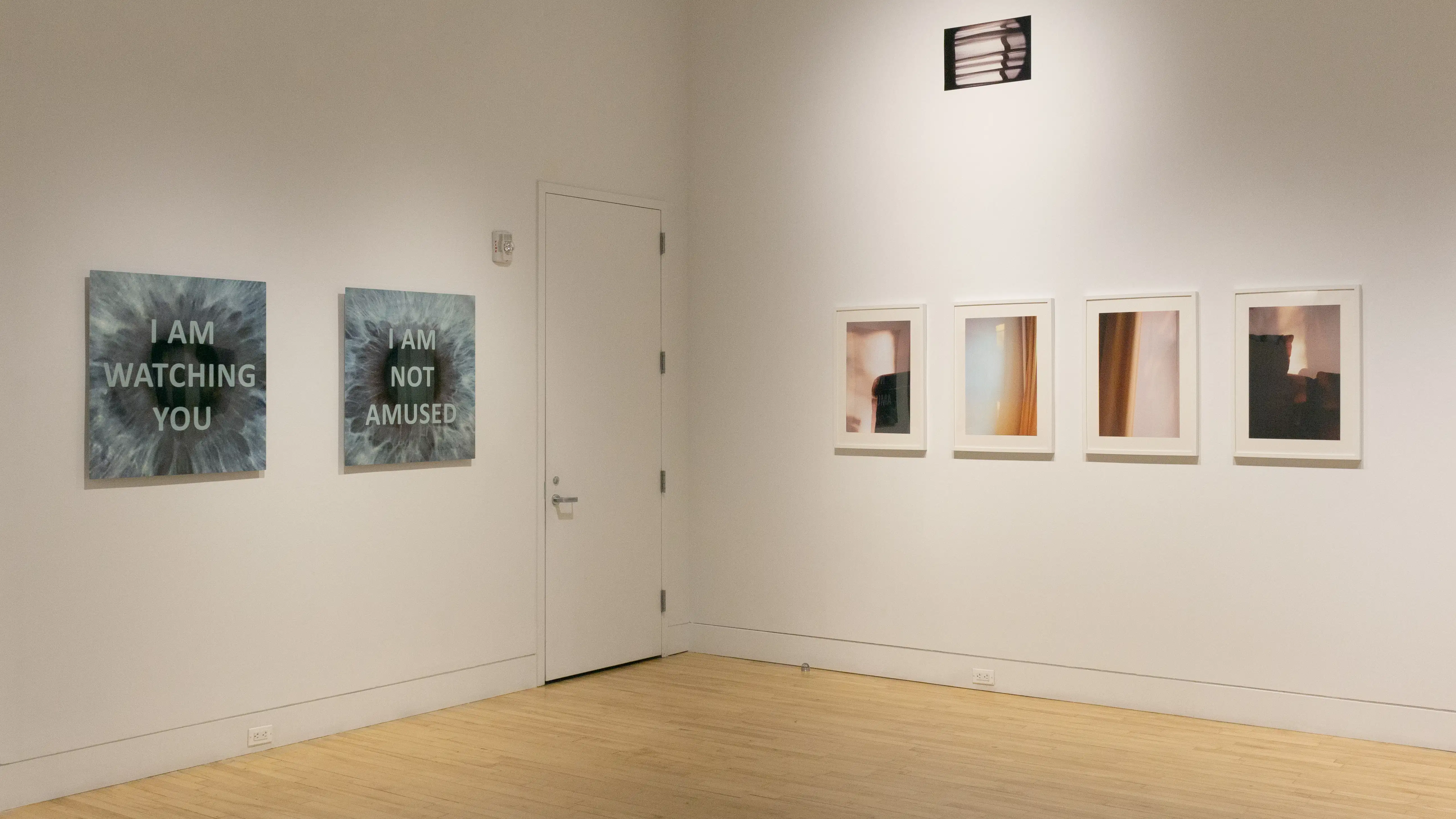 Multiple views of SVA Flatiron Gallery and Windows with installation, photographs, and textile throughout the gallery. 