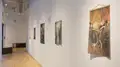 Multiple views of SVA Flatiron Gallery and Windows with installation, photographs, and textile throughout the gallery. 
