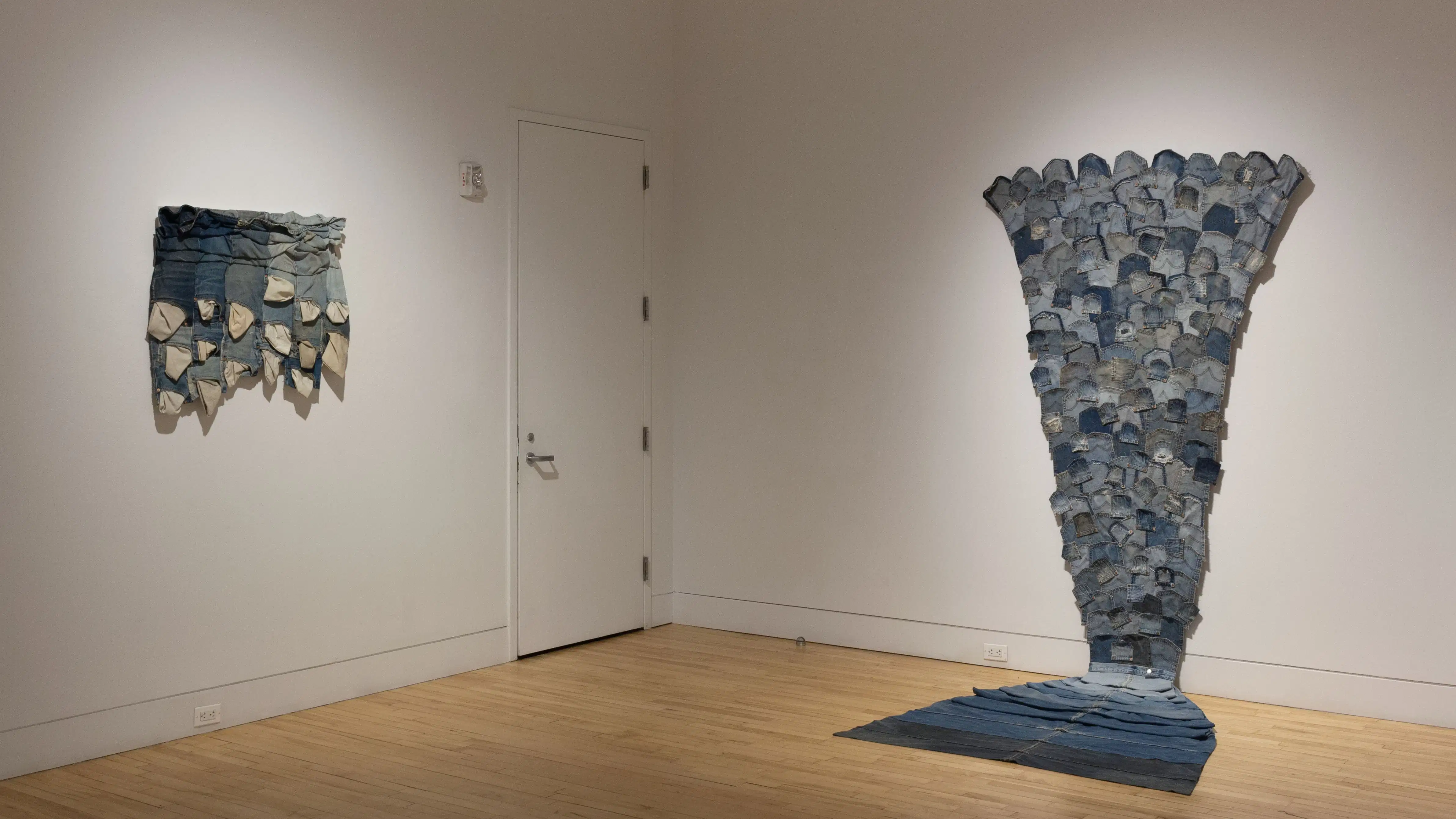 Multiple views of SVA Flatiron Gallery and Windows. There are photographs, collages, and installation work throughout the gallery and displayed in the windows. 