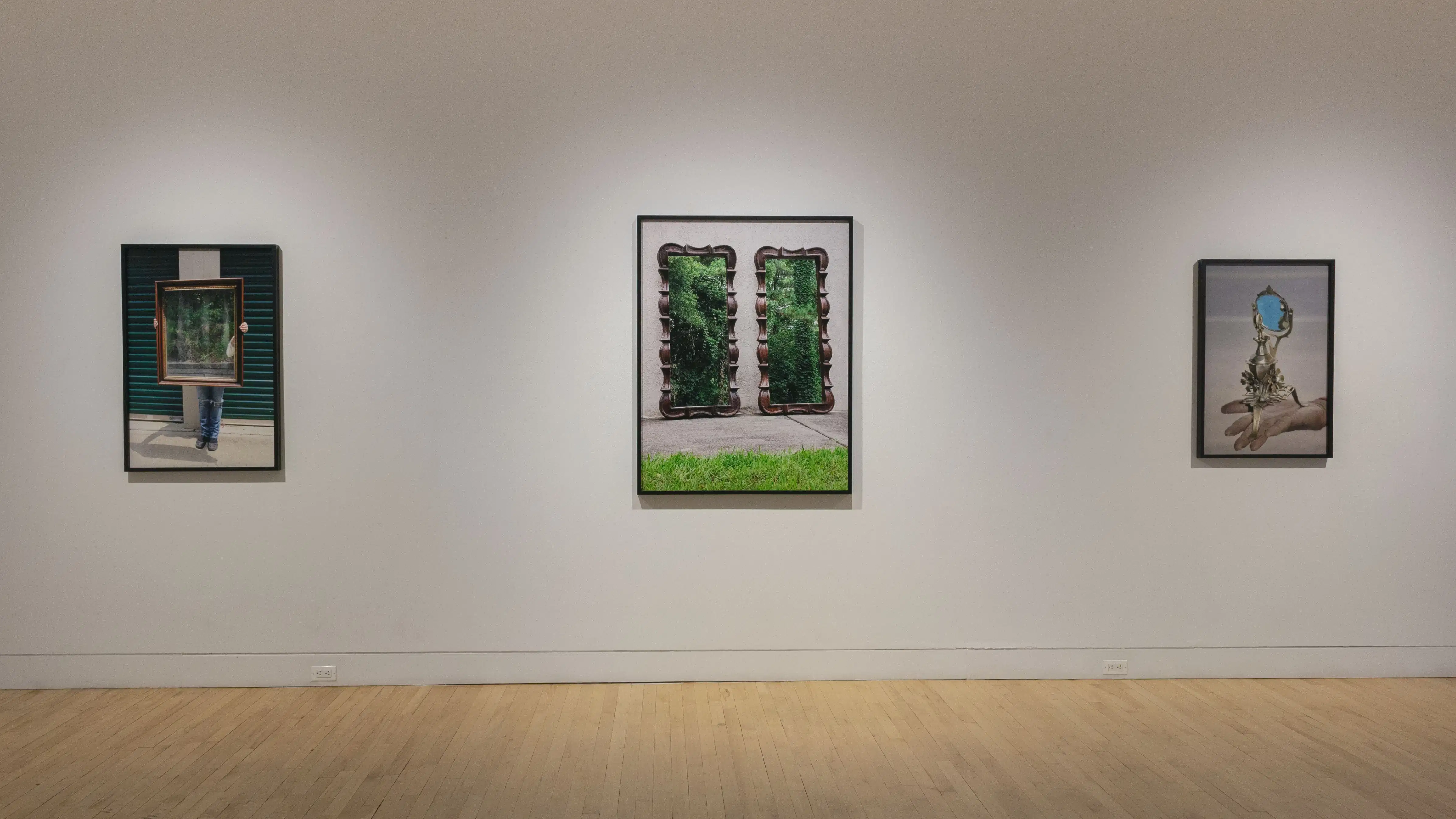 Multiple views of SVA Flatiron Gallery and Windows. There are photographs, collages, and installation work throughout the gallery and displayed in the windows. 