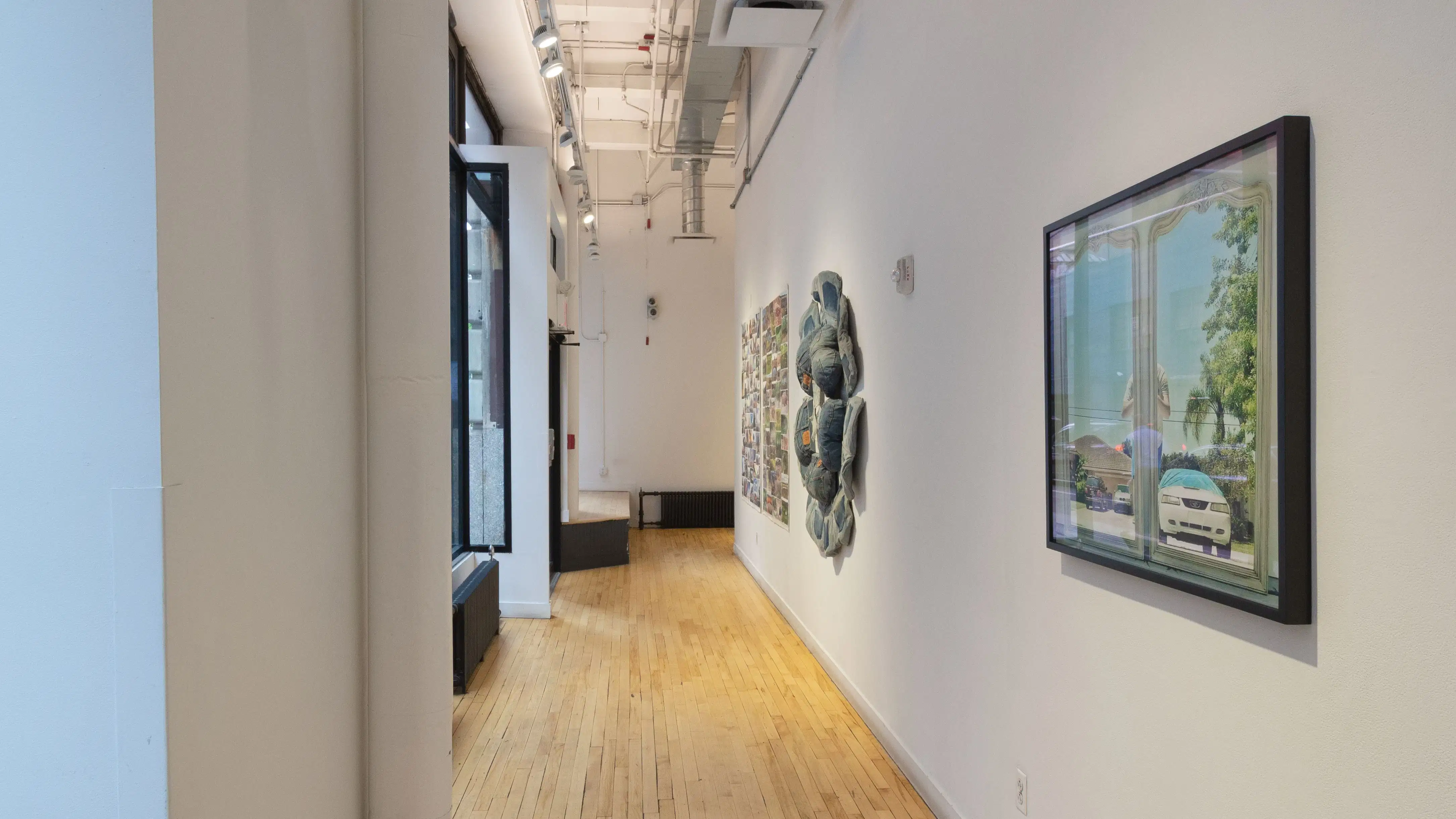 Multiple views of SVA Flatiron Gallery and Windows. There are photographs, collages, and installation work throughout the gallery and displayed in the windows. 