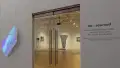 Multiple views of SVA Flatiron Gallery and Windows. There are photographs, collages, and installation work throughout the gallery and displayed in the windows. 