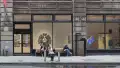 Multiple views of SVA Flatiron Gallery and Windows. There are photographs, collages, and installation work throughout the gallery and displayed in the windows. 