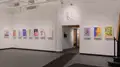 Multiple views of SVA Gramercy Gallery. Posters with illustrations are hung on the walls. 