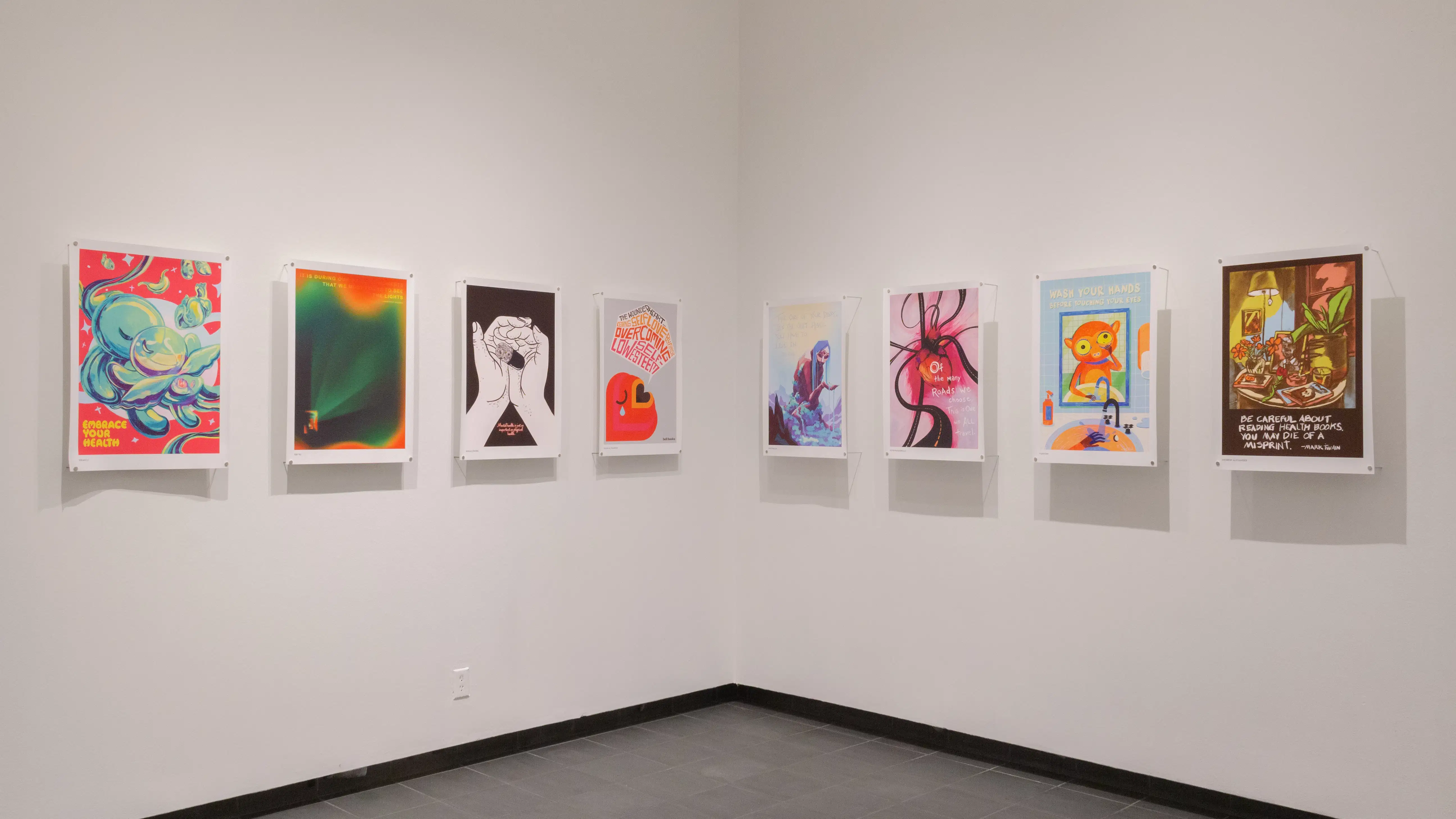 Multiple views of SVA Gramercy Gallery. Posters with illustrations are hung on the walls. 