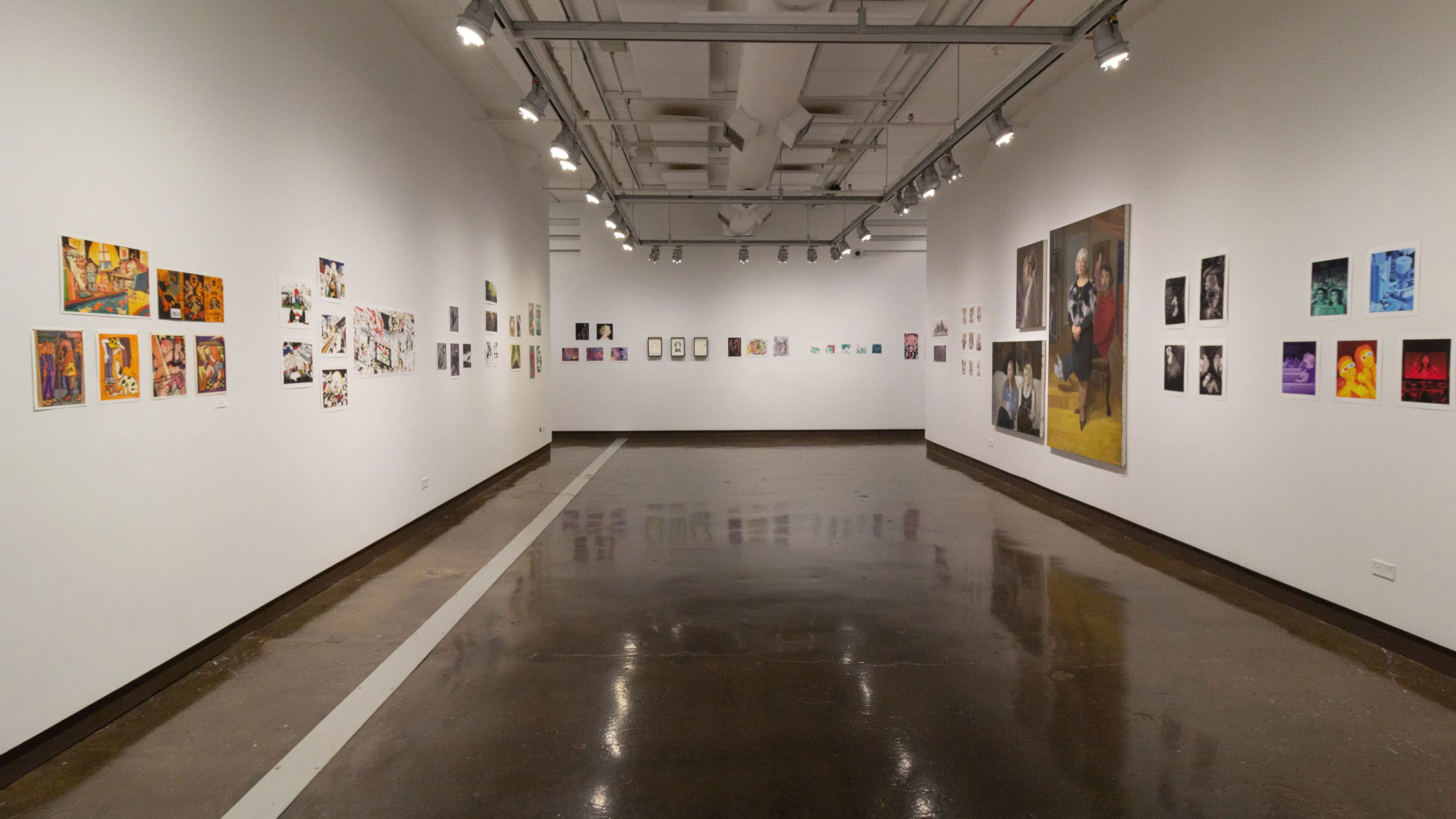 Multiple views of SVA Chelsea Gallery. There is illustrations and paintings hung on the walls. There are multiple shelves throughout the gallery with books places on them.