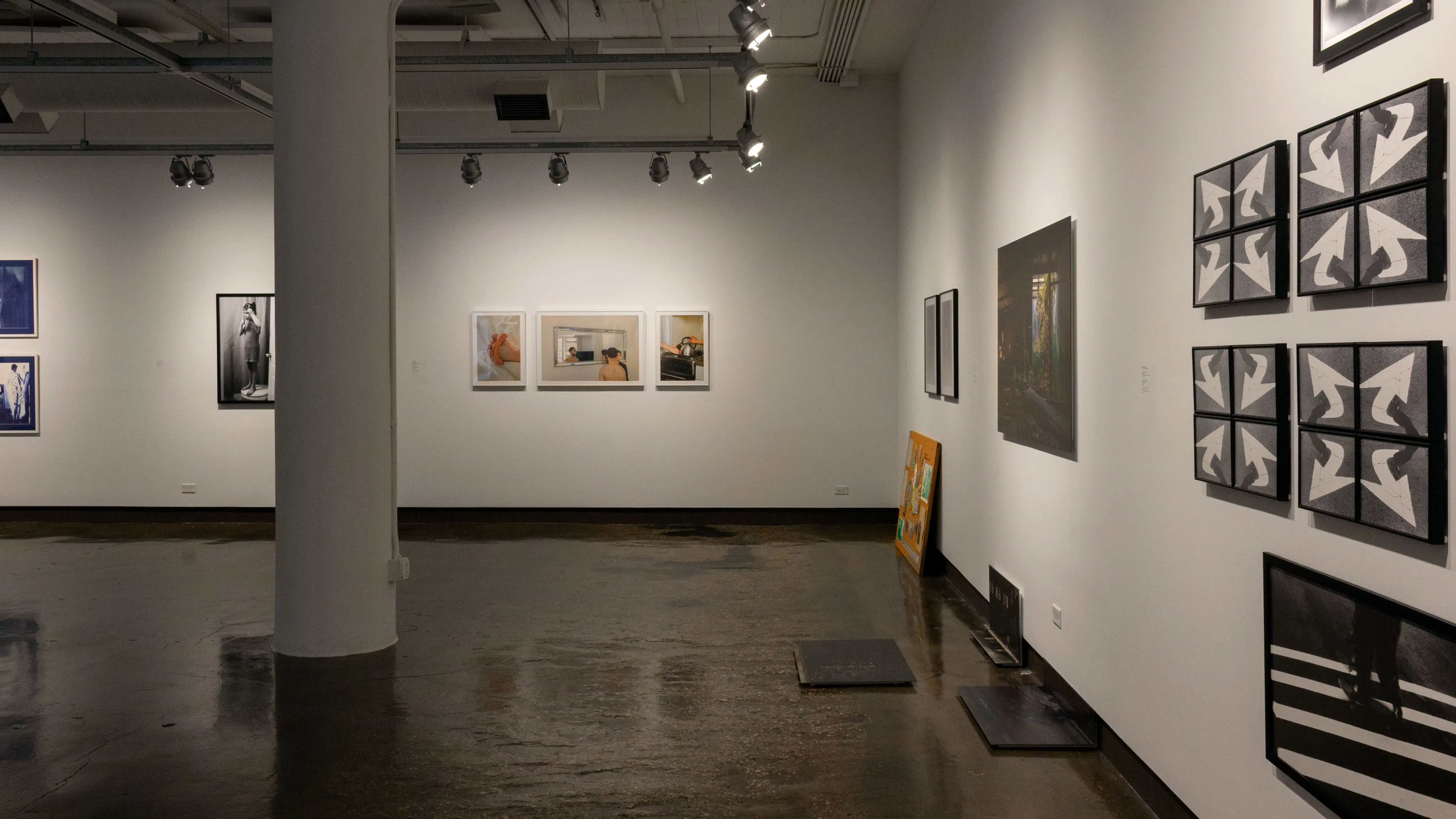 Multiple views of SVA Chelsea Gallery. There are photographs hung on the wall, installations and projections throughout the gallery. 