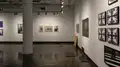 Multiple views of SVA Chelsea Gallery. There are photographs hung on the wall, installations and projections throughout the gallery. 