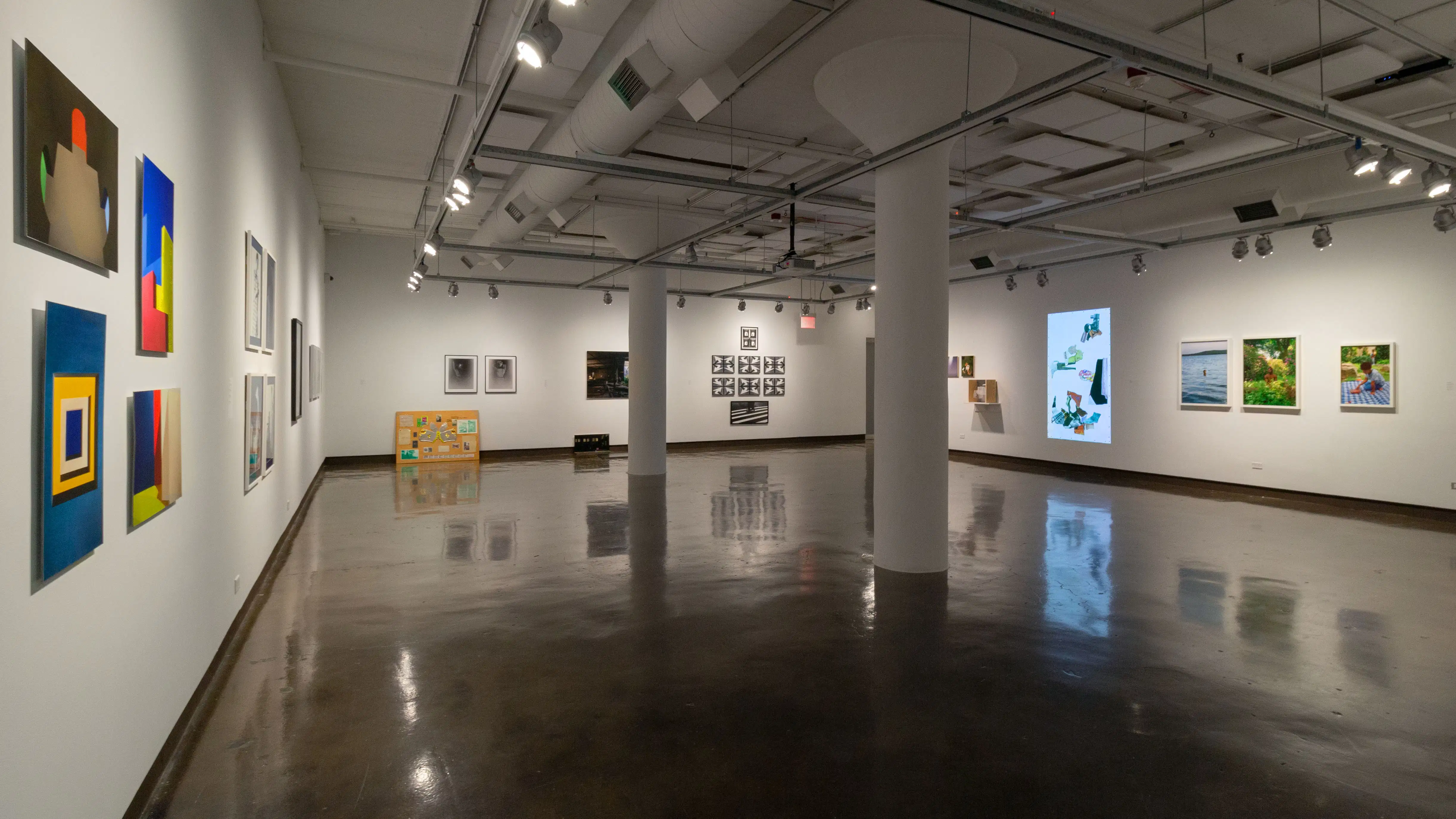 Multiple views of SVA Chelsea Gallery. There are photographs hung on the wall, installations and projections throughout the gallery. 