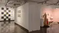 Multiple views of SVA Chelsea Gallery. There are photographs hung on the wall, installations and projections throughout the gallery. 