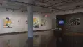 Multiple views of SVA Chelsea Gallery with framed and unframed photographs, video, and installation with projectors. 