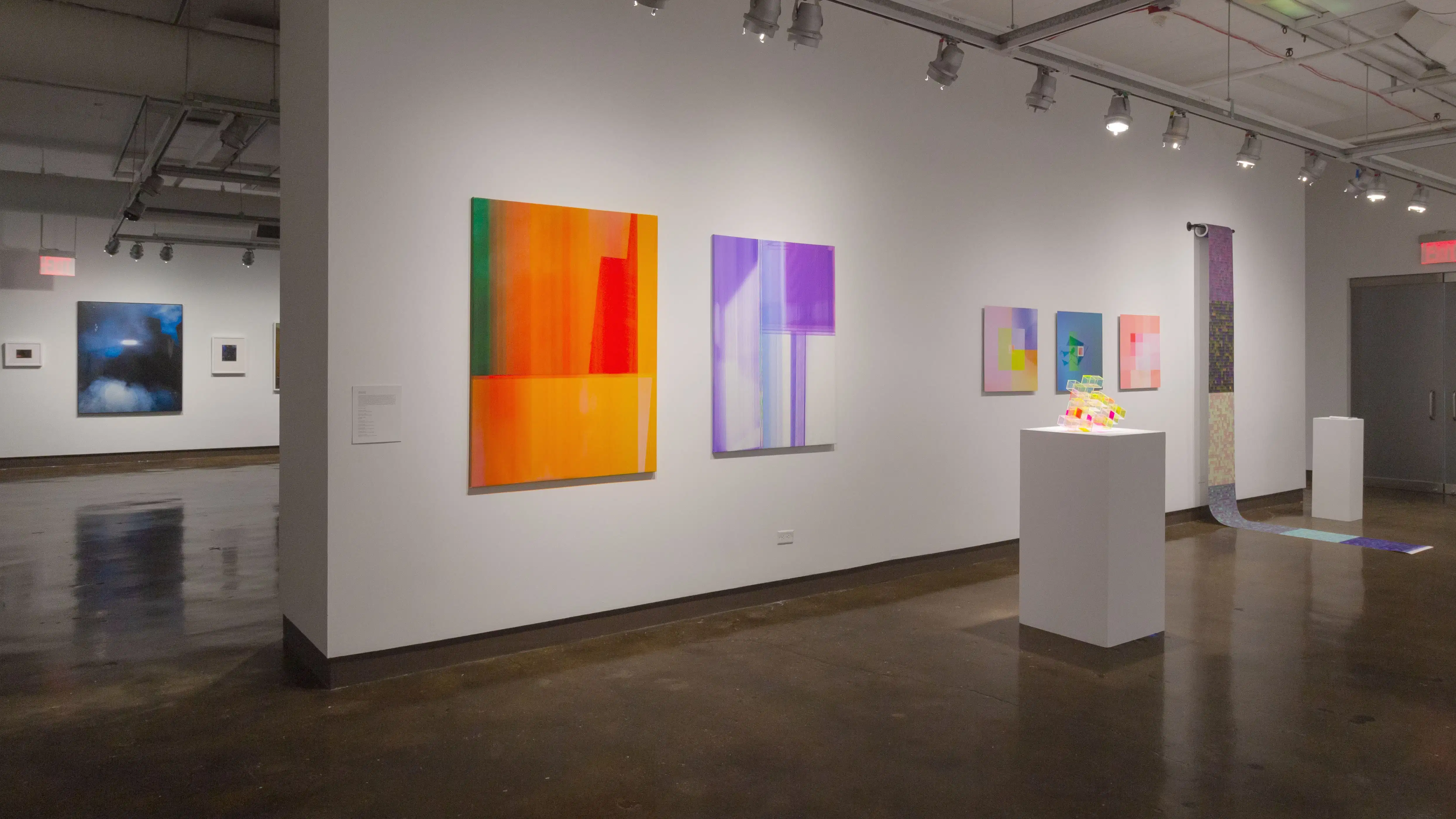 Multiple views of SVA Chelsea Gallery with framed and unframed photographs, video, and installation with projectors. 