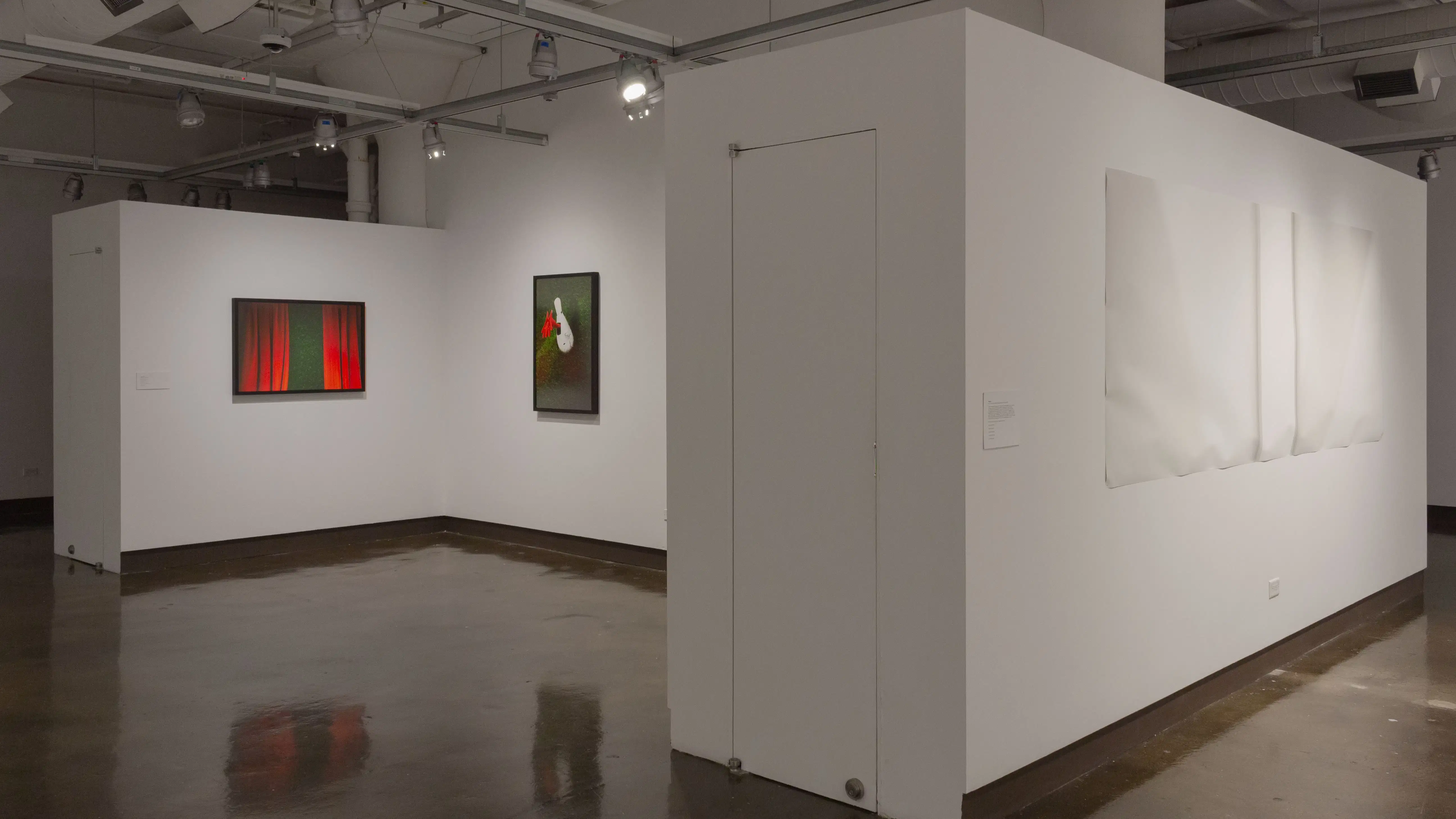 Multiple views of SVA Chelsea Gallery with framed and unframed photographs, video, and installation with projectors. 