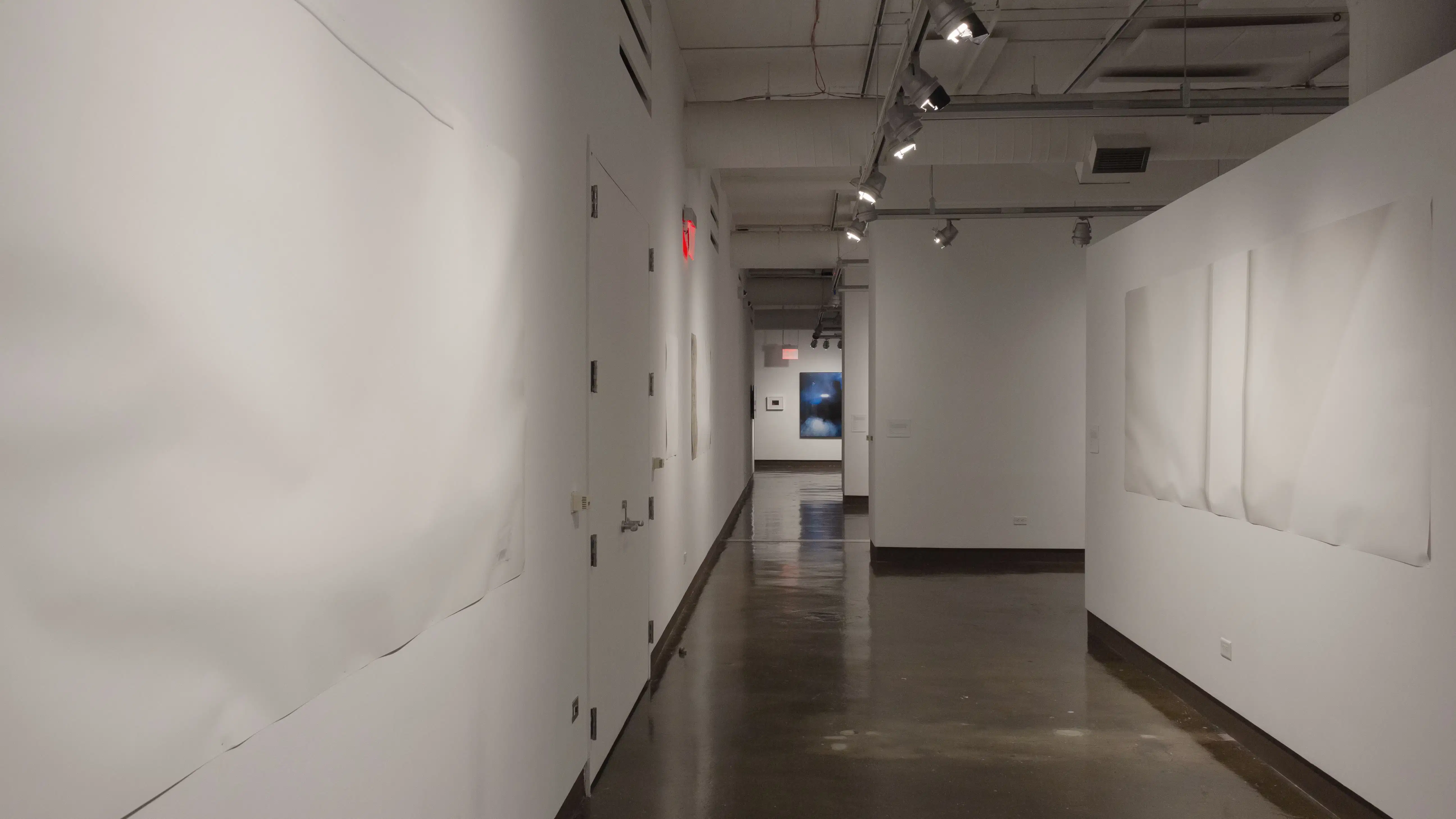 Multiple views of SVA Chelsea Gallery with framed and unframed photographs, video, and installation with projectors. 