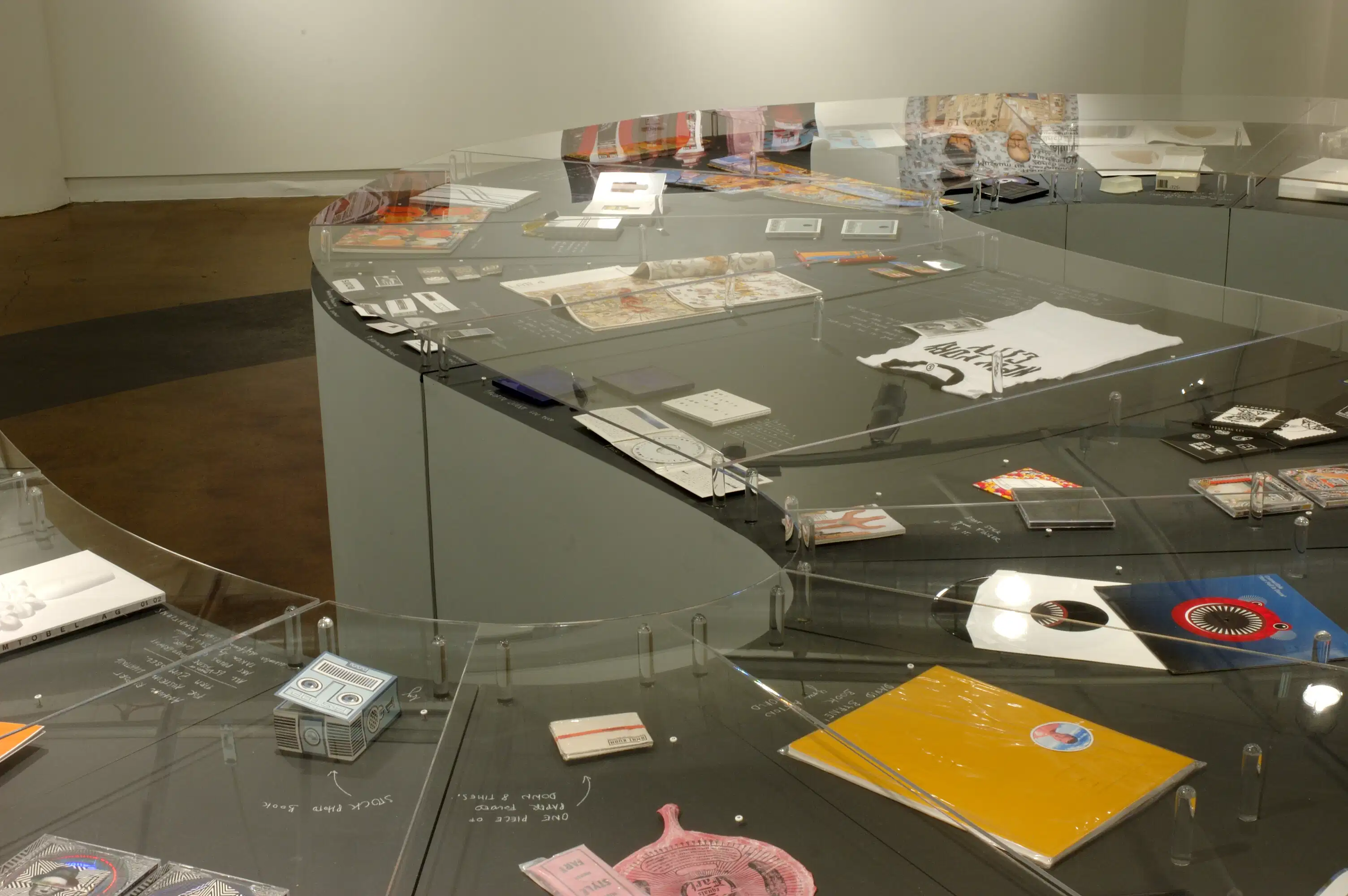 A glass display of several objects.