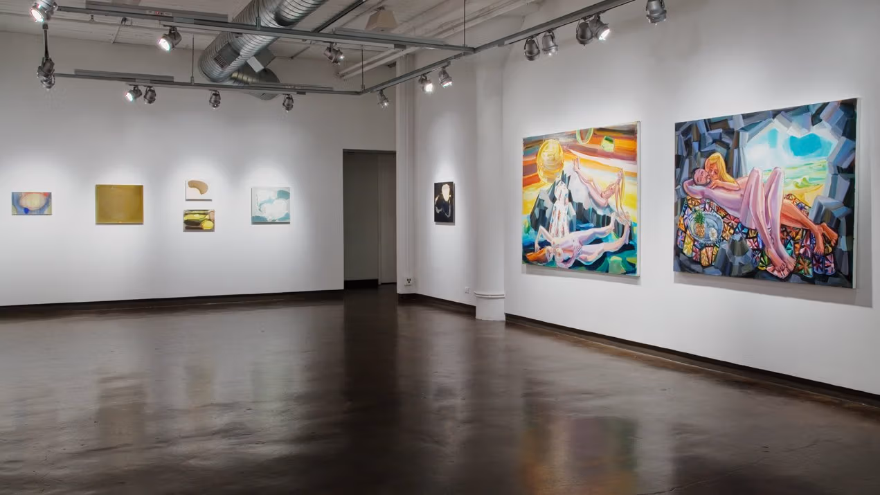 Exhibition photograph of “Between Picture and Viewer," with five small abstract paintings in muted colors on the back left wall, and on the right wall is a small black abstract painting next to two larger figurative paintings in bright colors.