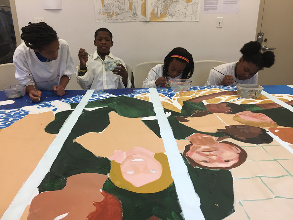 These kids are painting a Mural.