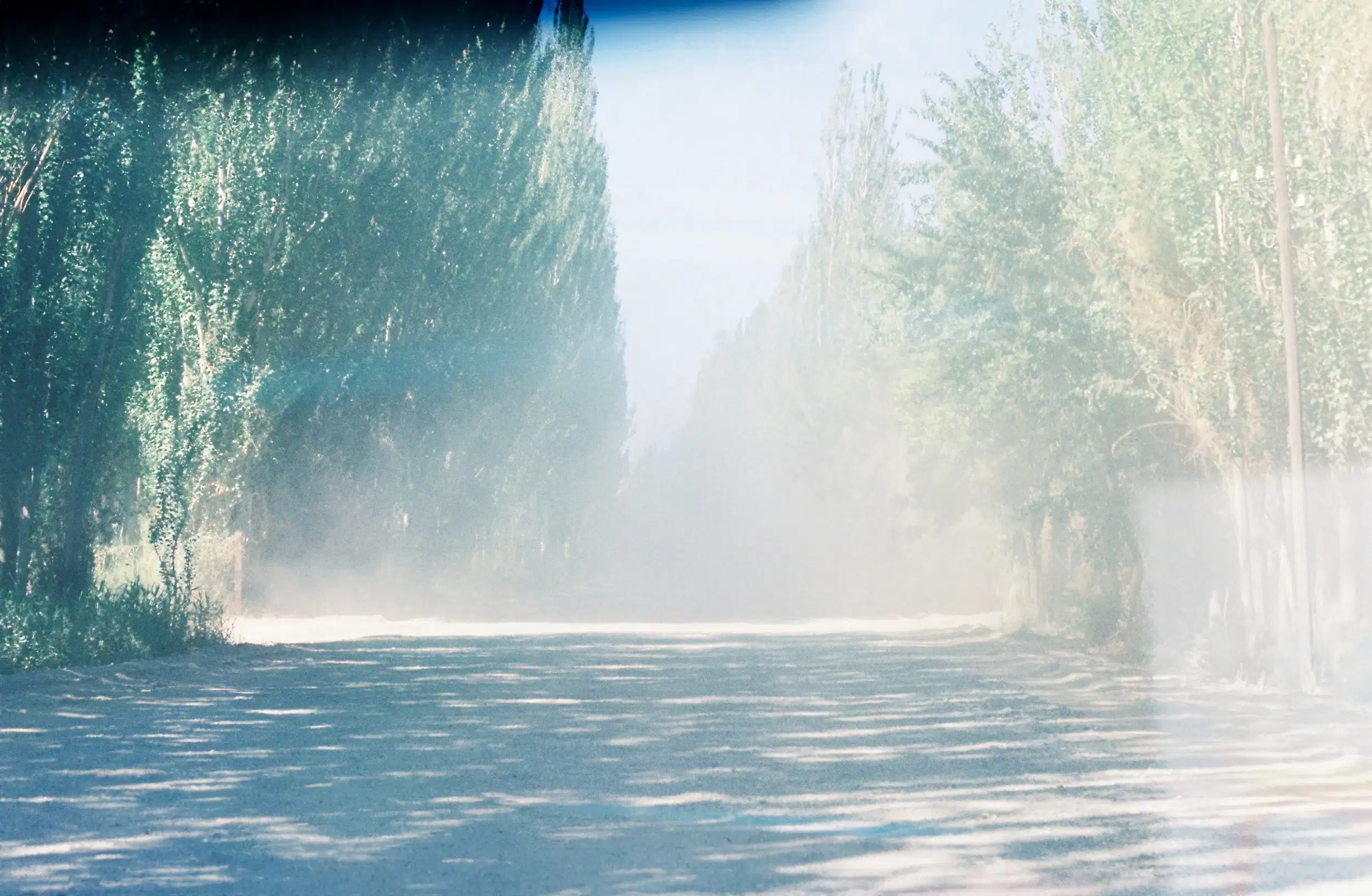 The window view of the boulevard, sand blown by the wind like fog